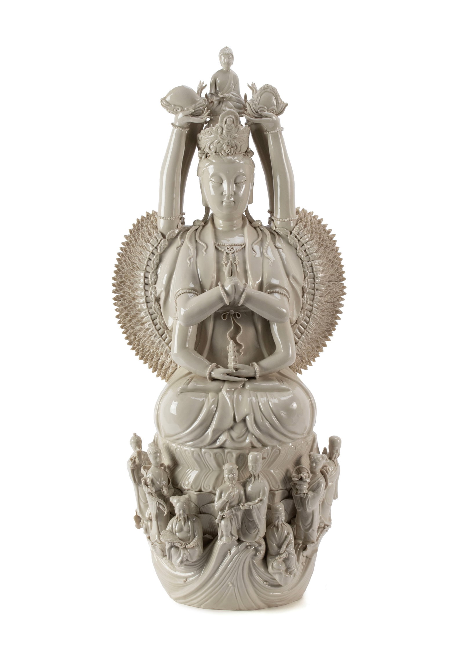 BLANC DE CHINE BODHISATTVA: BLANC DE CHINE BODHISATTVA Chinese, 20th century. Depicts Quan Yin, the goddess of compassion, in the thousand-arm form, with a Buddha figure a top her head, seated on a lotus base surrounded by