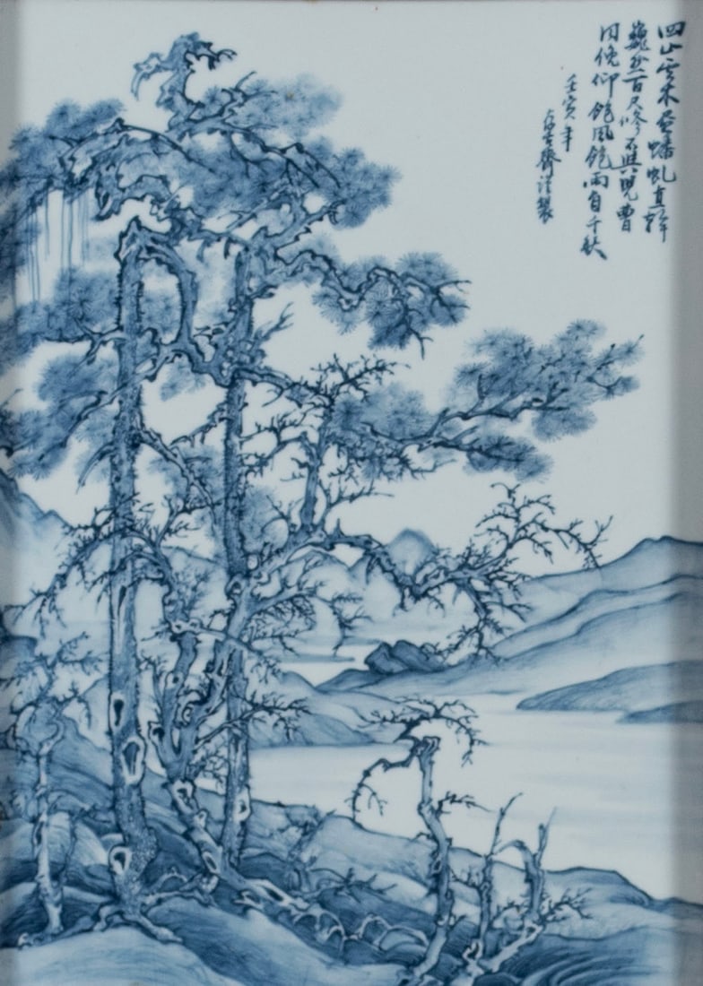 CHINESE PORCELAIN LANDSCAPE PLAQUE: CHINESE PORCELAIN LANDSCAPE PLAQUE Chinese, 20th century. Blue and white landscape plaque with inscription upper right, framed. 13 1/2 x 9 1/2 in. (34.3 x 24.1 cm.), Frame: 21 1/2 x 15 1/2 in. (54.6