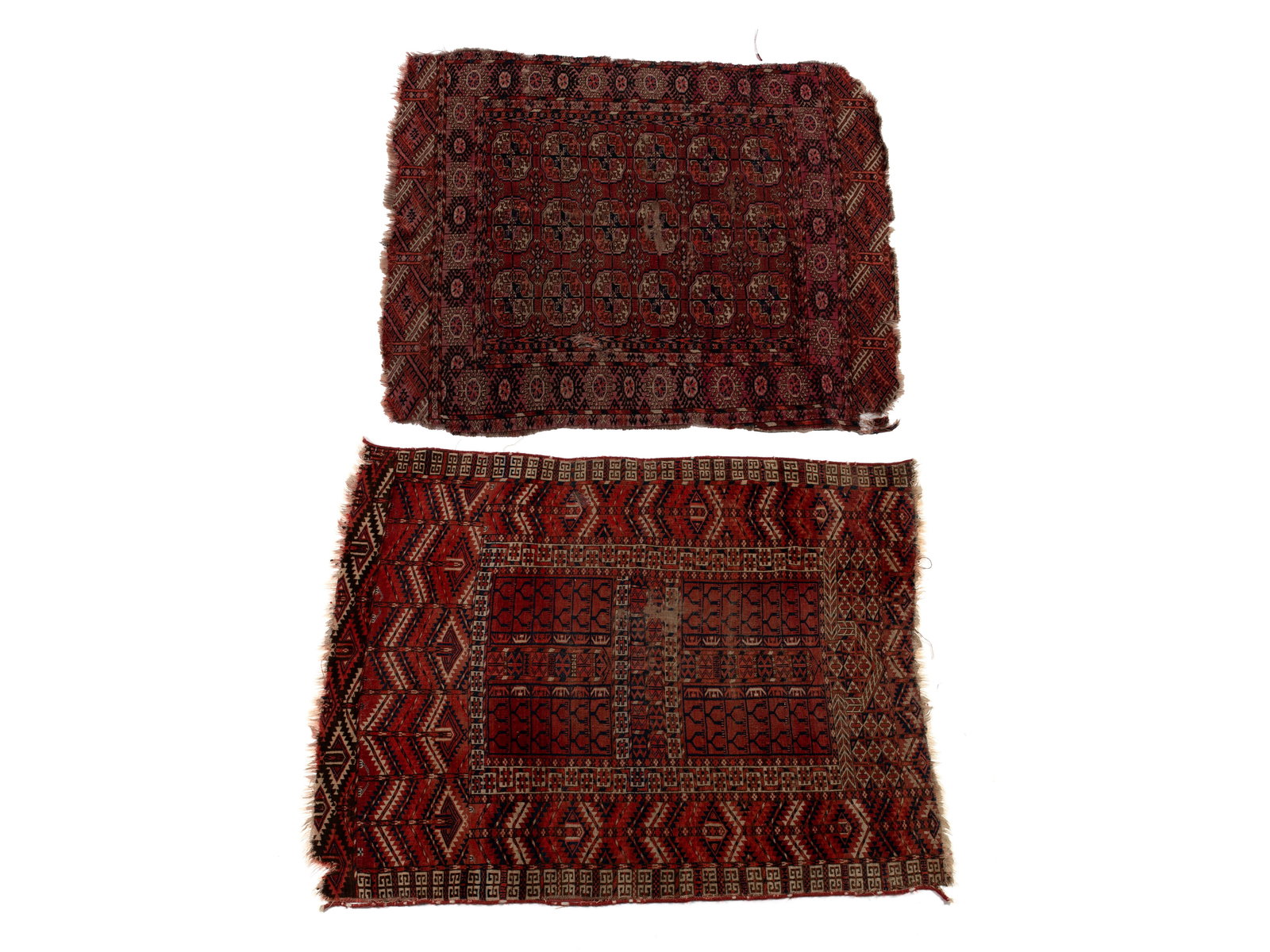 TWO TURKISH AREA RUGS: TWO TURKISH AREA RUGS Turkish, 19th century. The larger is a Tekke Ensi door flap decorated with geometric panels and motifs in shades of ivory and near black with red surroundings. Together with a Bo