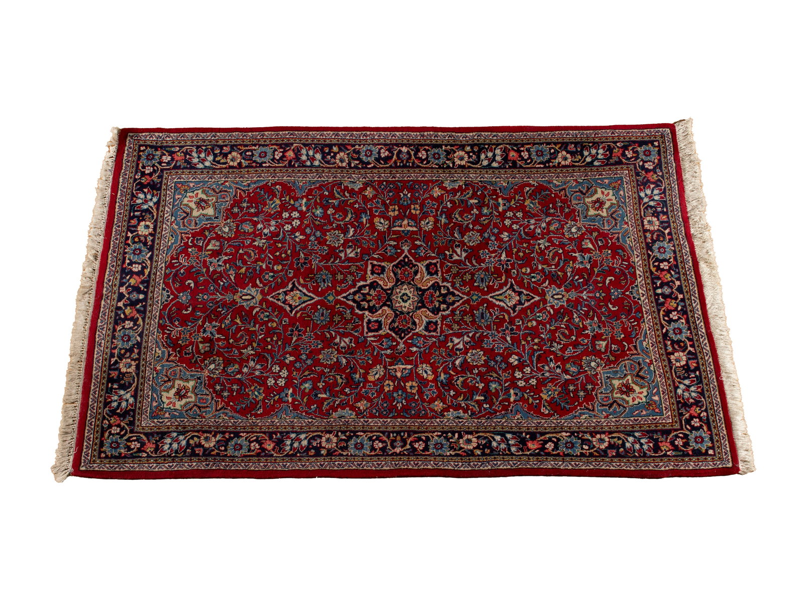 SAROUK AREA RUG: SAROUK AREA RUG Persian, circa 1970s. Navy pole medallion centers the red field covered with flowering vines showing royal blue corners, floral navy border with multiple guard borders. 6 ft. 10 in. x 
