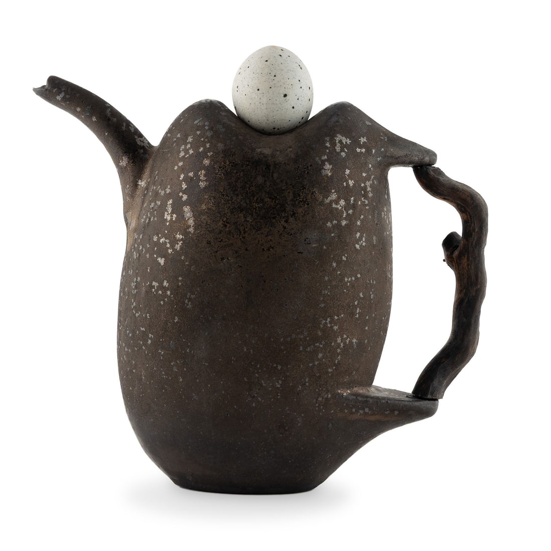 DAVID SHANER (AMERICAN, 1934-2002) STUDIO POTTERY TEAPOT: DAVID SHANER (AMERICAN, 1934-2002) STUDIO POTTERY TEAPOT Circa 1990s, artist stamp to underside, glazed stoneware. Vertical pillow-form with wooden stick-form handle and river rock stone lid. 9 x 3 3/