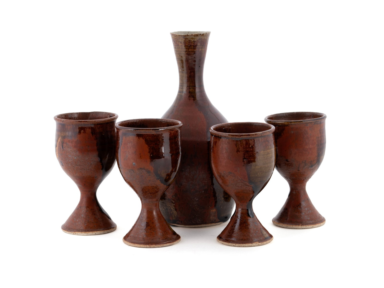 DAVID BATZ (1944-1994) CERAMIC CARAFE AND FOUR GOBLETS: DAVID BATZ (1944-1994) CERAMIC CARAFE AND FOUR GOBLETS 20th century. Studio pottery sake carafe with matching goblets, carafe signed on underside. Carafe: 9 in. (22.9 cm.), Goblet: 5 1/4 in. (13.3