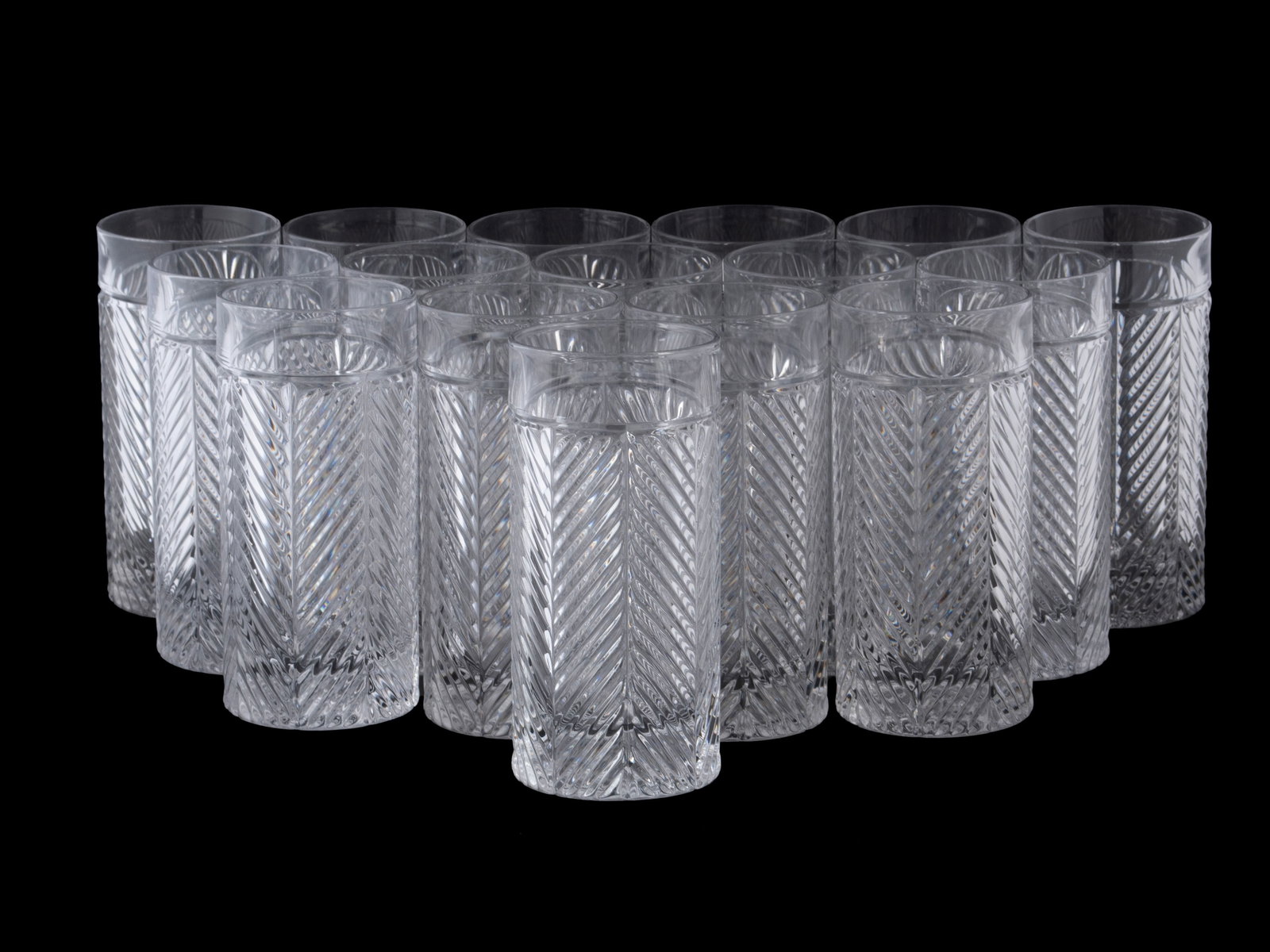 GROUP OF RALPH LAUREN HIGH BALL GLASSES: GROUP OF RALPH LAUREN HIGH BALL GLASSES Sixteen (16) glasses in the Herringbone pattern, etched marks to underside. 6 1/4 x 3 in. (15.9 x 7.6 cm.)