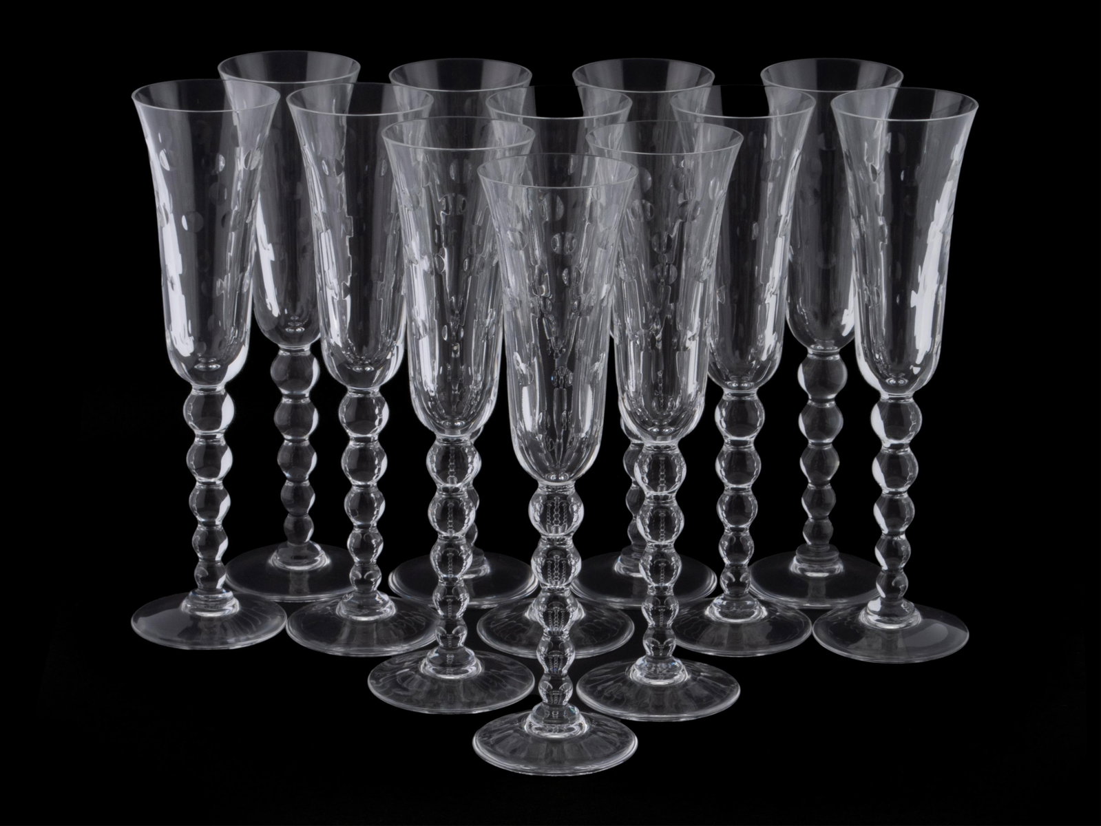 SET OF TWELVE SAINT LOUIS 'BUBBLE' CHAMPAGNE FLUTES: SET OF TWELVE SAINT LOUIS 'BUBBLE' CHAMPAGNE FLUTES 20th century. Etched marks on underside. 9 1/4 in. (23.5 cm.)