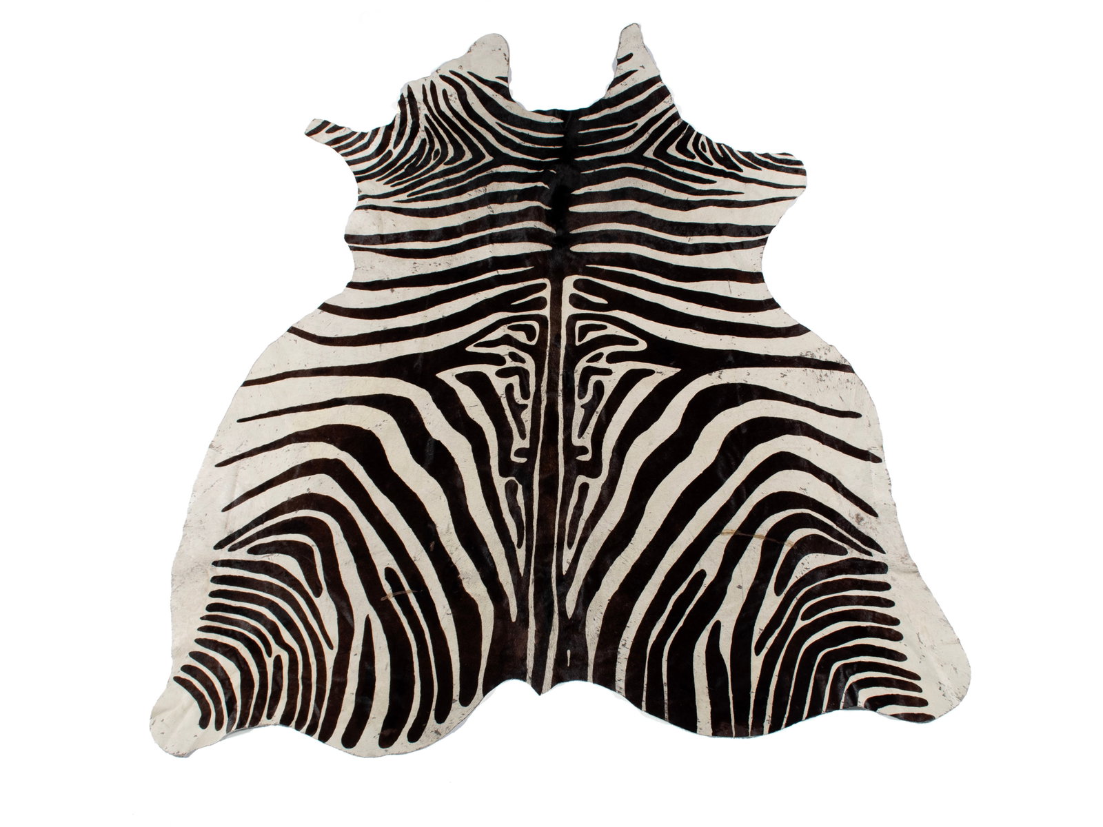 ZEBRA PATTERN HIDE RUG: ZEBRA PATTERN HIDE RUG 20th century. Cowhide area rug mimicking zebra. 77 x 68 in. (195.6 x 172.7 cm.)