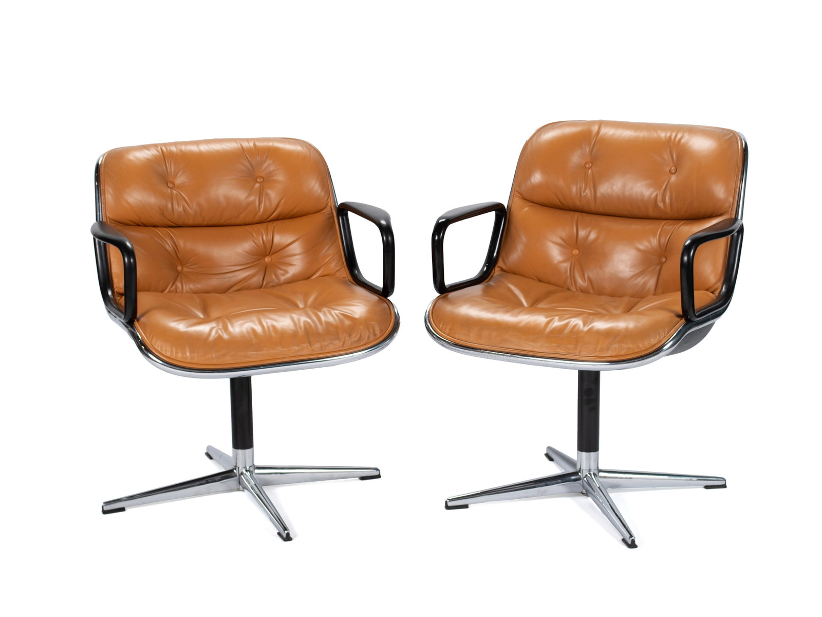 PAIR OF CHARLES POLLOCK FOR KNOLL EXECUTIVE ARMCHAIRS: PAIR OF CHARLES POLLOCK FOR KNOLL EXECUTIVE ARMCHAIRS American, mid-20th century. Tufted saddle brown leather on chrome stationary base, labels to underside. 31 x 26 1/2 x 20 in. (78.7 x 67.3 x 50.8
