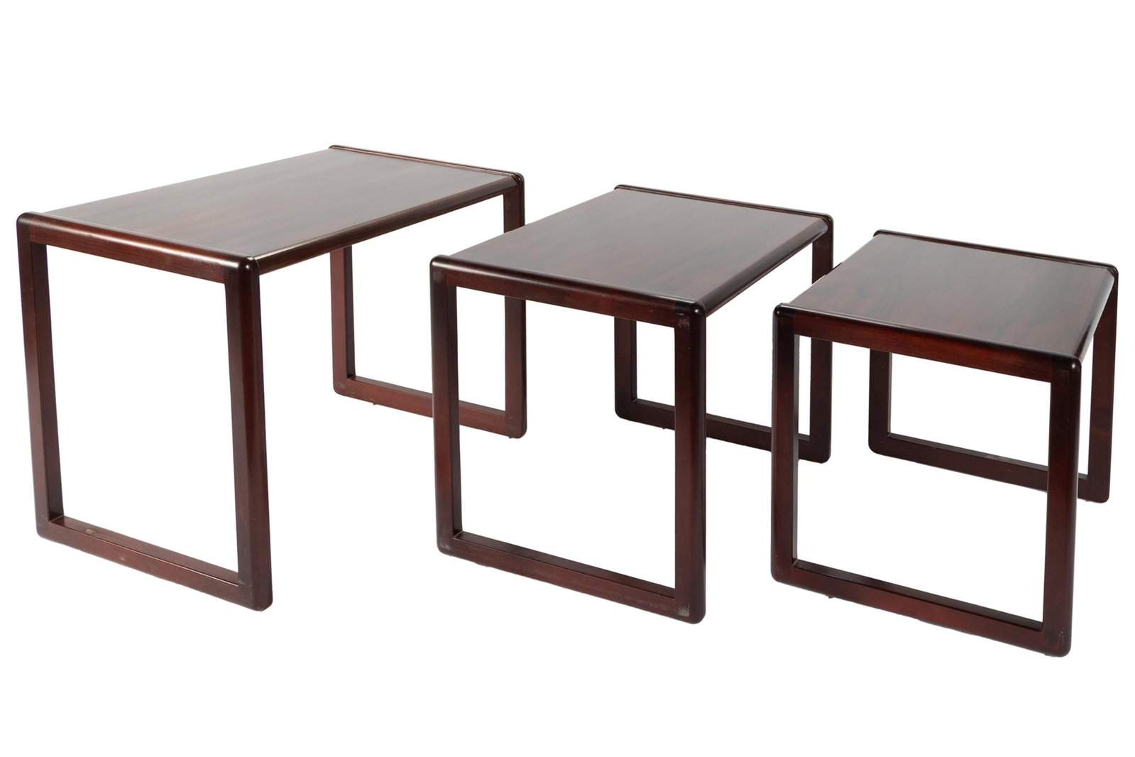 SET OF THREE DANISH ROSEWOOD NESTING TABLES: SET OF THREE DANISH ROSEWOOD NESTING TABLES Preben Schou/Vildbjerg Mobelfabrik, mid-20th century. Stamped and labeled on underside. Largest: 17 1/2 x 24 x 15 in. (44.5 x 61 x 38.1 cm.)