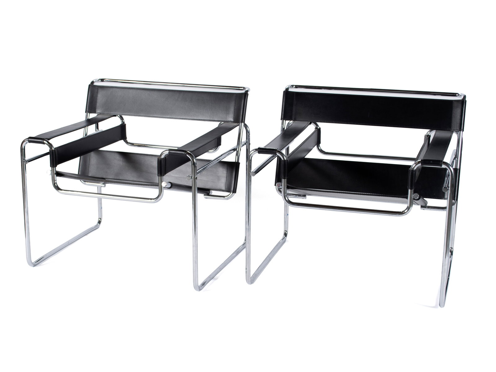 PAIR OF 'WASSILY' B3 CHAIRS BY MARCEL BREUER FOR KNOLL: PAIR OF 'WASSILY' B3 CHAIRS BY MARCEL BREUER FOR KNOLL American, circa 1990s, designed 1925. Black leather on chrome plated steel frame. Etched signature to chrome leg and Breuer Collection label