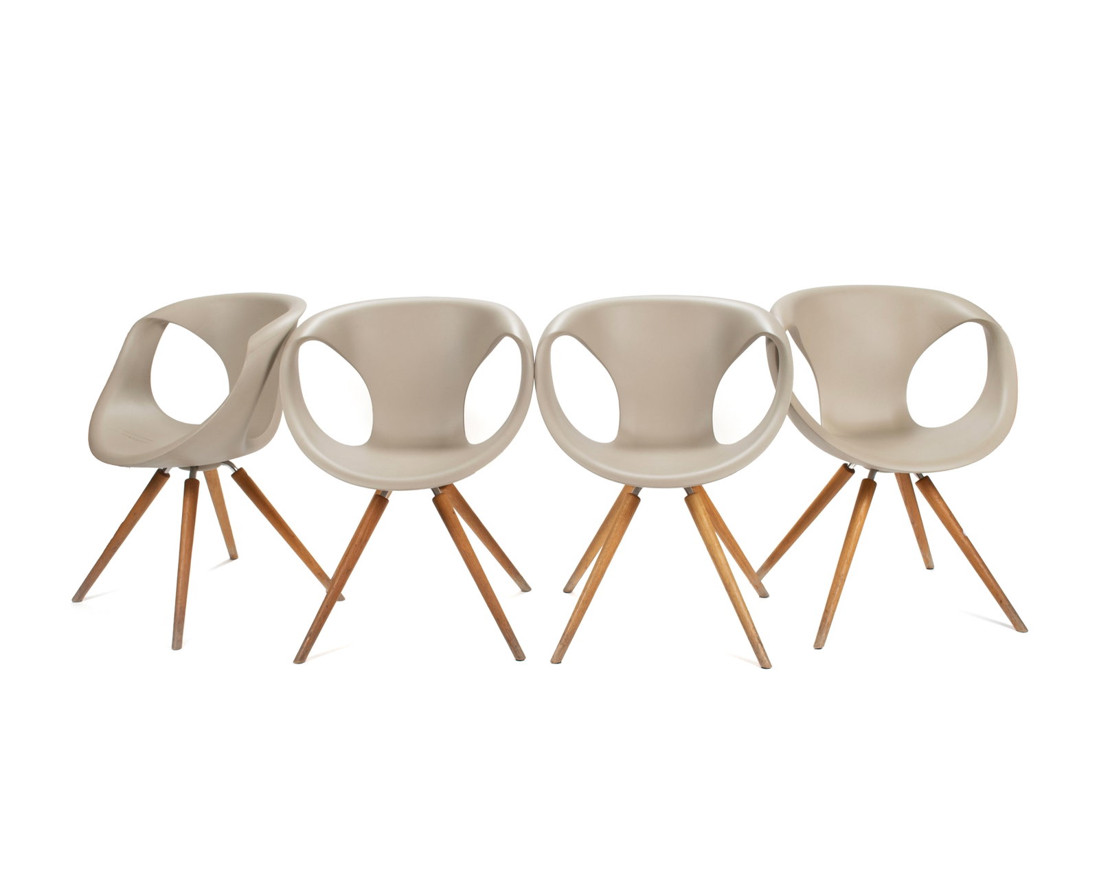 FOUR 'UP' CHAIRS BY TONON: FOUR 'UP' CHAIRS BY TONON Italian, designed by Martin Ballendat. Four (4) chairs with tan polyurethane shells on wooden legs, marked under seat. Each: 32 1/4 x 24 in. (81.9 x 61 cm.) Collection of
