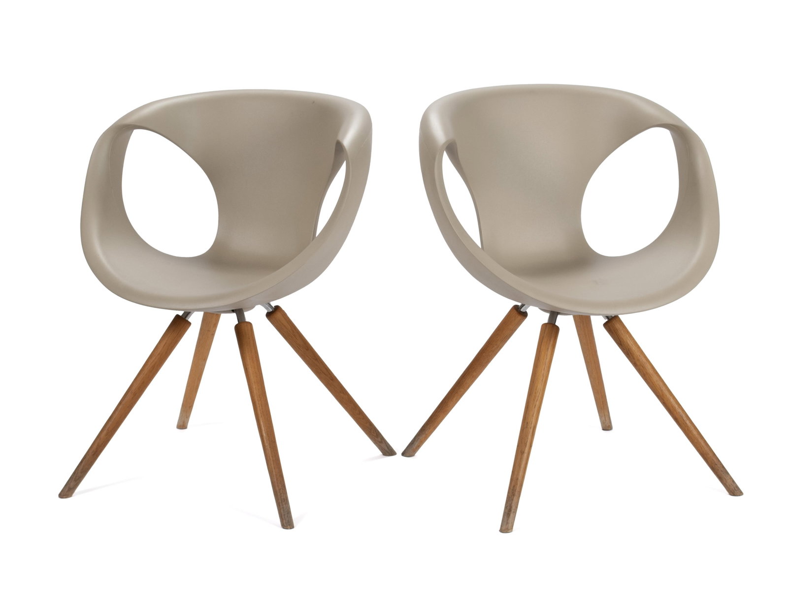 TWO 'UP' CHAIRS BY TONON: TWO 'UP' CHAIRS BY TONON Italian, designed by Martin Ballendat. Two (2) chairs with tan polyurethane shells on wooden legs, marked under seat. Each: 32 1/4 x 24 in. (81.9 x 61 cm.) Ex Collection of