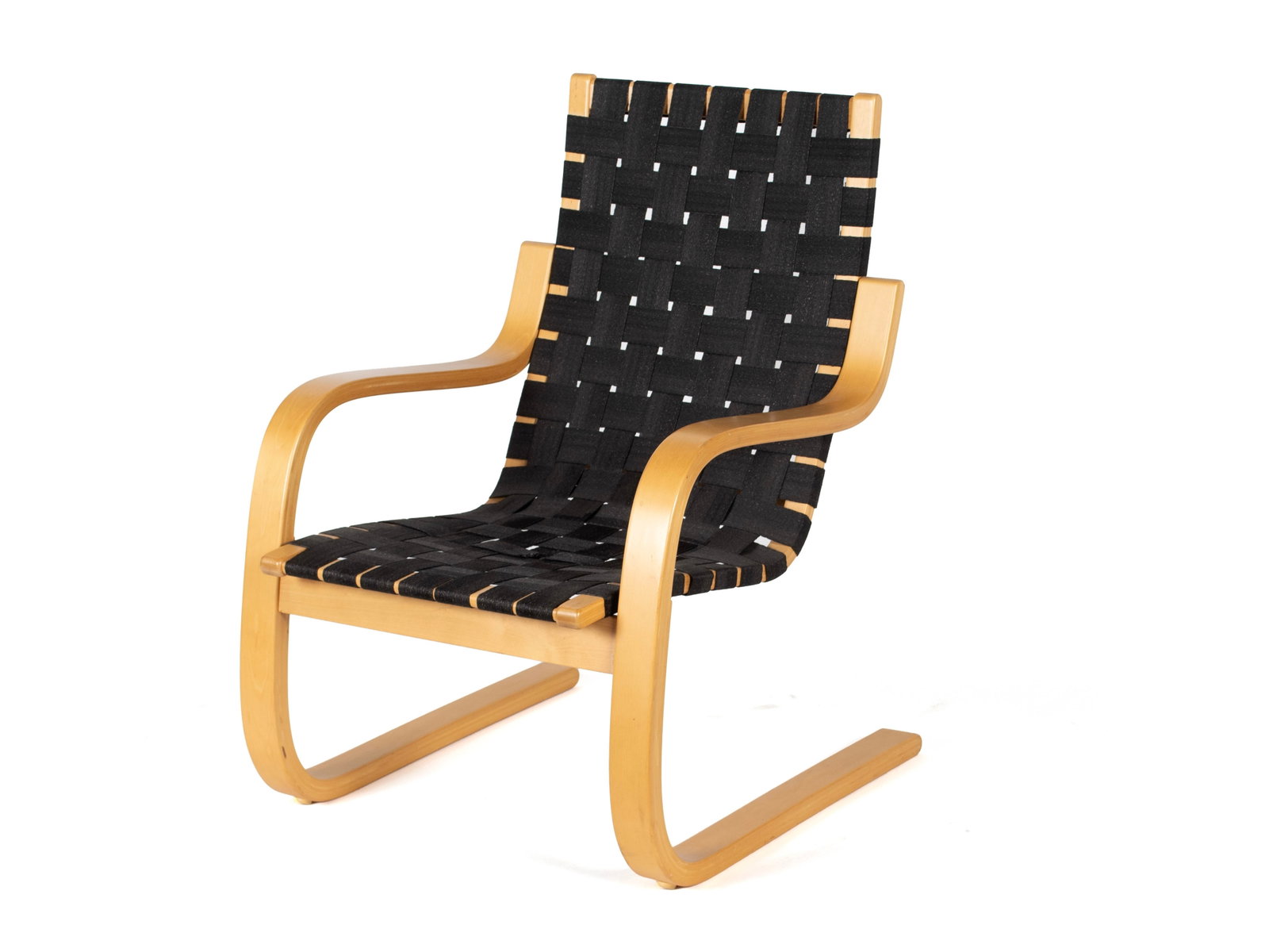 ALVAR AALTO 406 LOUNGE CHAIR FOR ARTEK: ALVAR AALTO 406 LOUNGE CHAIR FOR ARTEK Late 20th century. Bentwood frame with black canvas webbing. 34 x 29 x 23 1/4 in. (86.4 x 73.7 x 59.1 cm.)