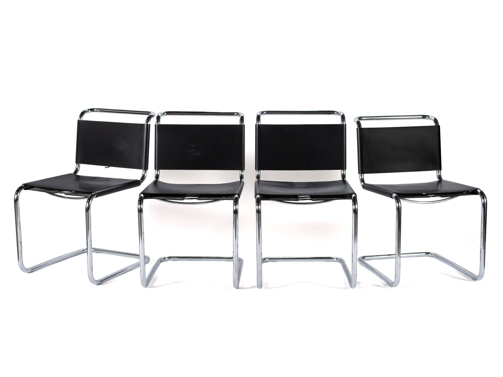 SET OF FOUR MARCEL BREUER B33 CANTILEVER CHAIRS: SET OF FOUR MARCEL BREUER B33 CANTILEVER CHAIRS 20th century. Four (4) black leather upholstered chairs with chrome frames, unmarked. 31 1/2 x 18 1/2 x 21 in. (80 x 47 x 53.3 cm.)