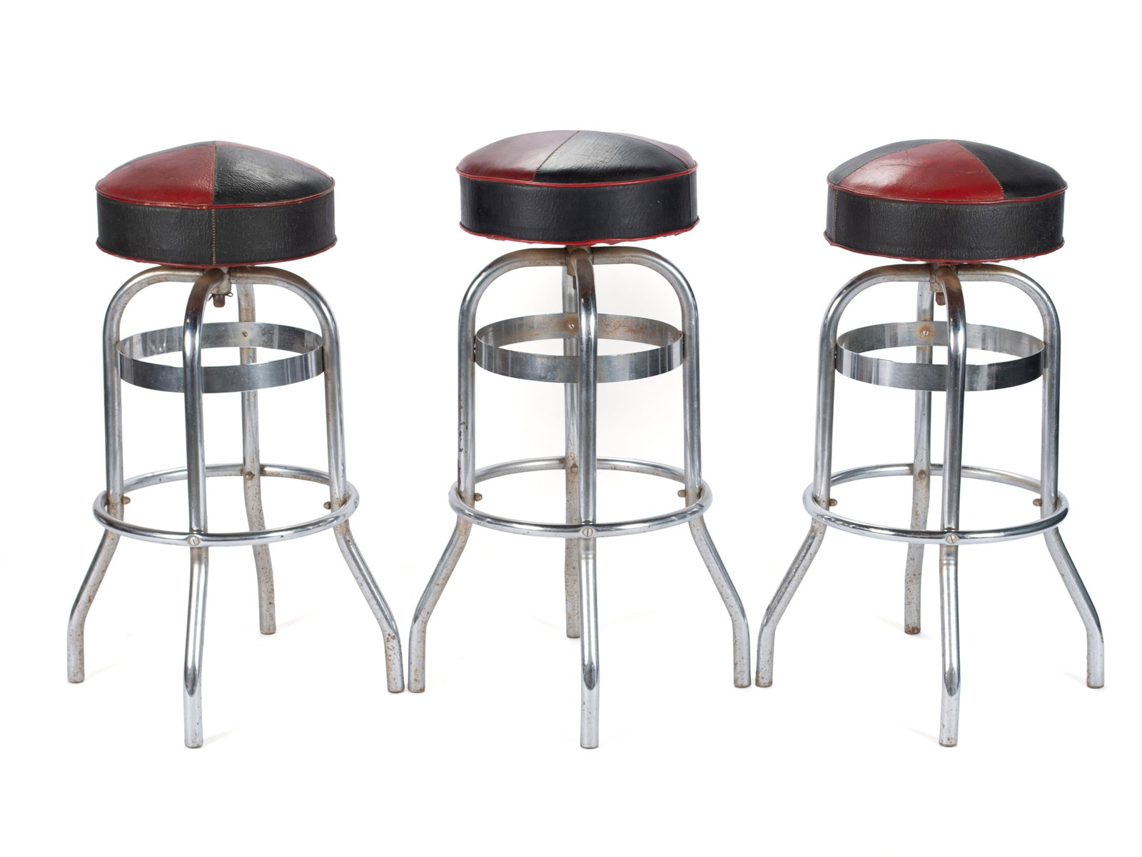 THREE HELENE CURTIS CHROME STOOLS: THREE HELENE CURTIS CHROME STOOLS American, 20th century, each labeled on underside. Chrome plated frames with black and red leather upholstered seats. 31 x 20 in. (78.7 x 50.8 cm.)