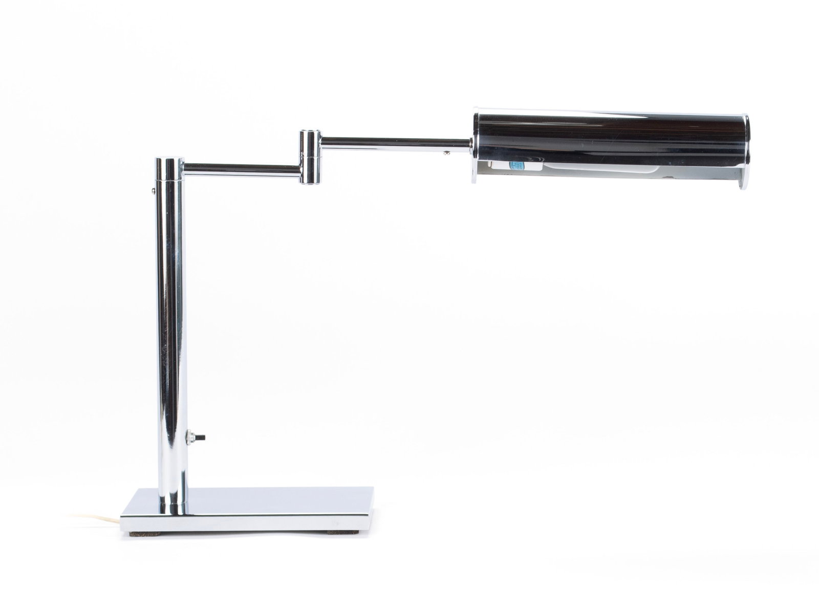 WALTER VON NESSEN FOR NESSEN STUDIOS DESK LAMP: WALTER VON NESSEN FOR NESSEN STUDIOS DESK LAMP American, mid-20th century. Chrome with an extending swing arm on a rectangular base. 13 1/2 x 20 3/4 x 5 in. (34.3 x 52.7 x 12.7 cm.) The Collection of