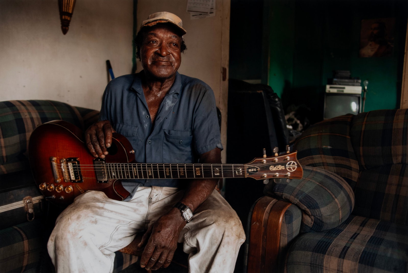 LOU BOPP (AMERICAN, B. 1963): Lou Bopp American, b. 1963 TL Williams at Home, 2010 Color photograph on archival paper From 'Portraits of the Blues' series, number 2 of 5, printed in 2013. Matted and framed with artist's gallery in