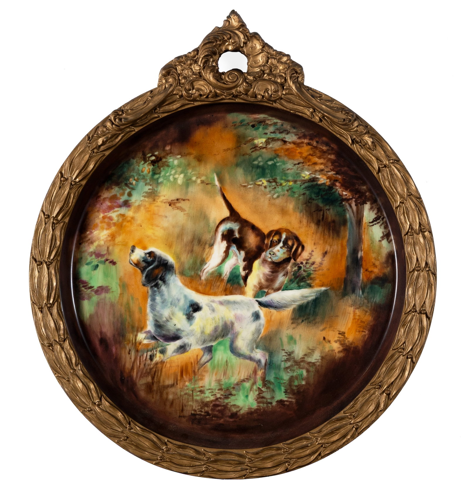 LIMOGES PORCELAIN HUNTING DOG PLATE: LIMOGES PORCELAIN HUNTING DOG PLATE French, 20th century, signed "M.W." in the image with the Limoges mark to the back. Two setters in the woods, framed. Diameter: 16 in. (40.6 cm.), Frame: 20 3/4 x 1