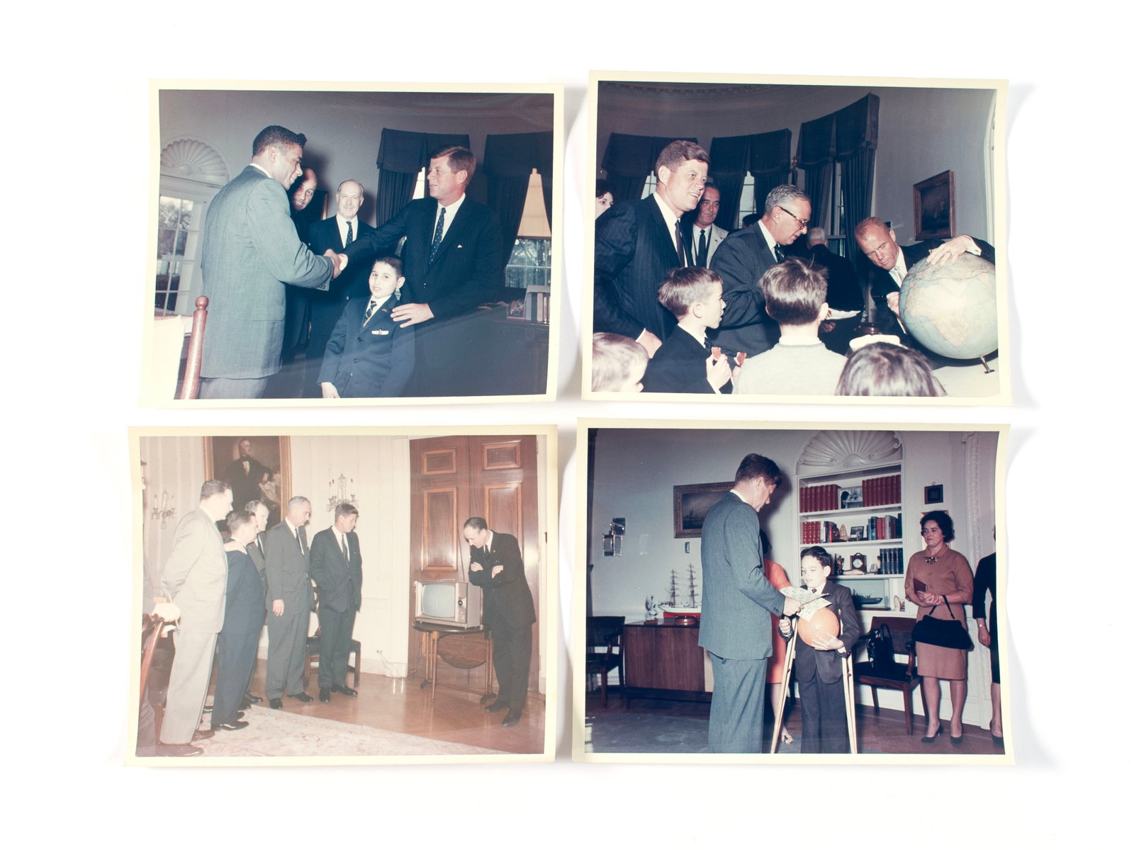 ROBERT L. KNUDSEN PRESIDENTIAL PHOTOGRAPHS WITH PRESIDENT KENNEDY: ROBERT L. KNUDSEN PRESIDENTIAL PHOTOGRAPHS WITH PRESIDENT KENNEDY Four (4) images taken by the official White House photographer. One showing Kennedy with other members of his cabinet watching a