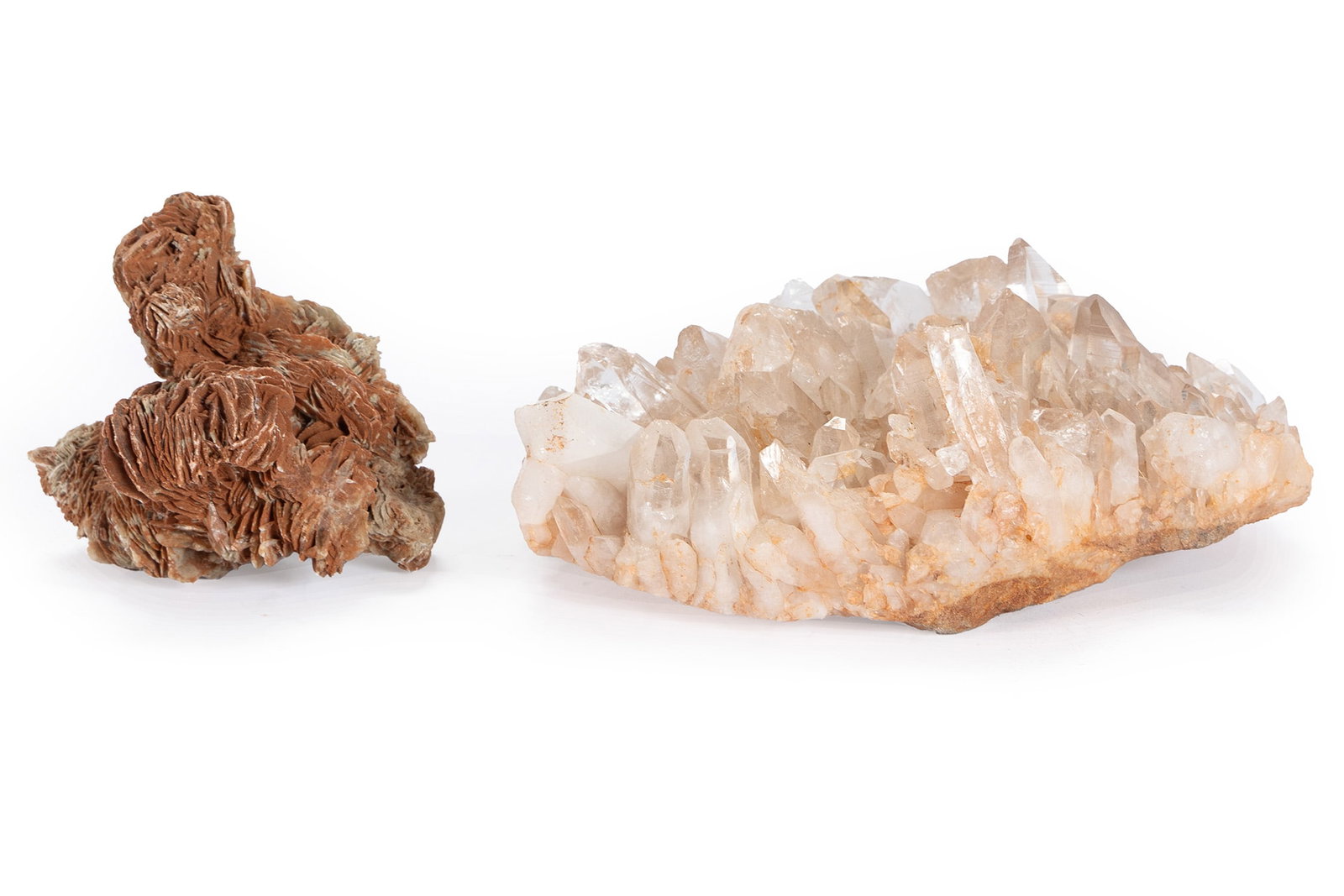 TWO CRYSTAL CLUSTERS: TWO CRYSTAL CLUSTERS Including a 'Desert Rose' and pink quartz. Larger: 4 x 10 1/2 x 7 in. (10.2 x 26.7 x 17.8 cm.), Smaller: 5 x 5 1/4 x 4 1/2 in. (12.7 x 13.3 x 11.4 cm.)