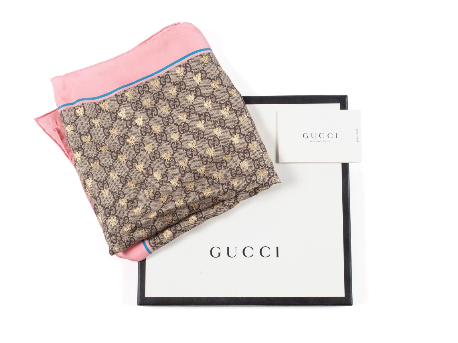 GUCCI MONOGRAM BEE SCARF: GUCCI MONOGRAM BEE SCARF Italian, 20th century. Silk scarf decorated with metallic bees throughout, NWT and original packaging, box and Responsibility care card. 32 x 32 in. (81.3 x 81.3 cm.)