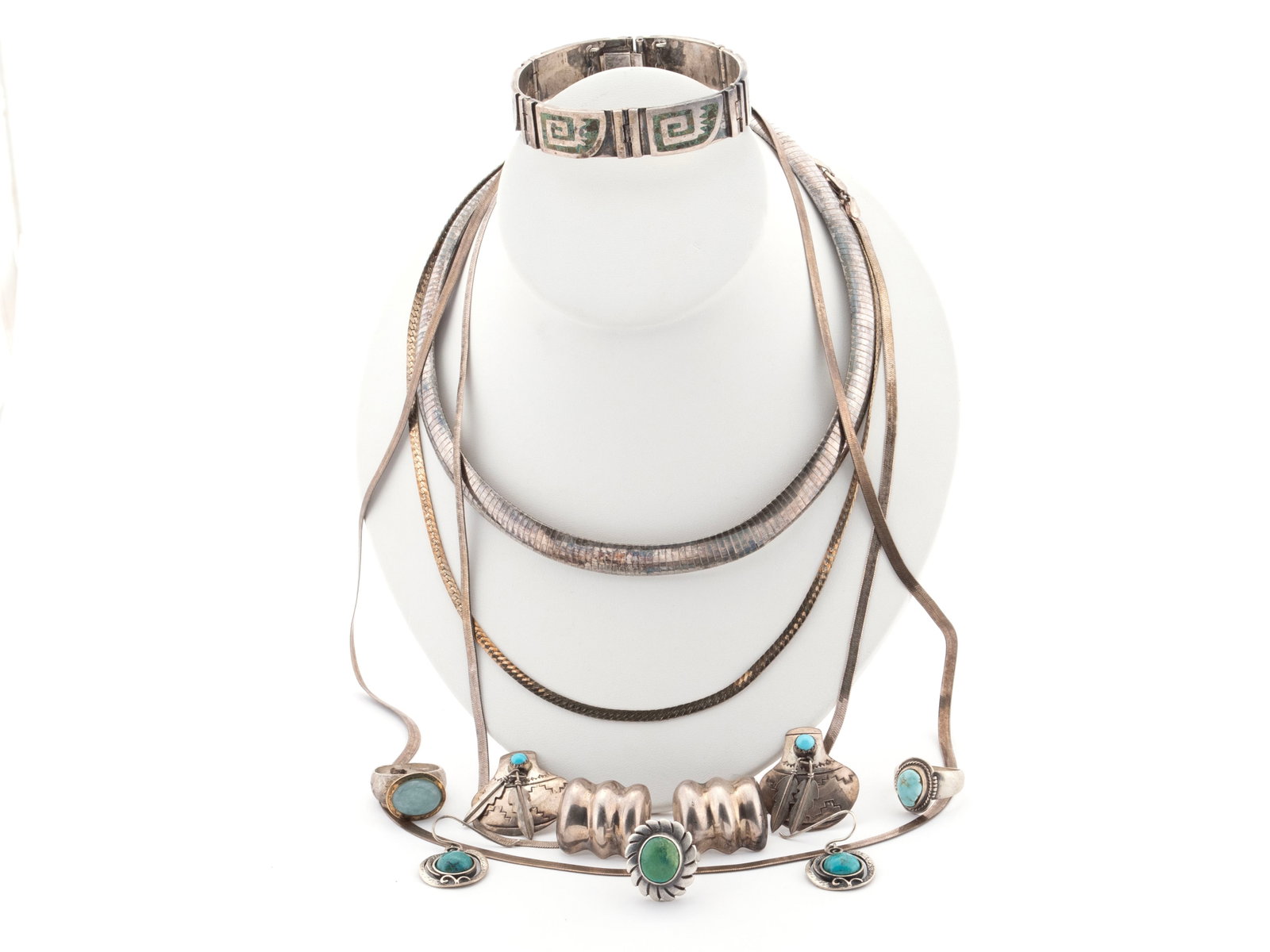 ASSORTMENT OF STERLING SILVER JEWELRY: ASSORTMENT OF STERLING SILVER JEWELRY Fourteen (14) pieces including one Miguel Melendez Aztec inlay link bracelet, three (3) rings; three (3) pairs of earrings: one by Sandoval, one by Sidai -