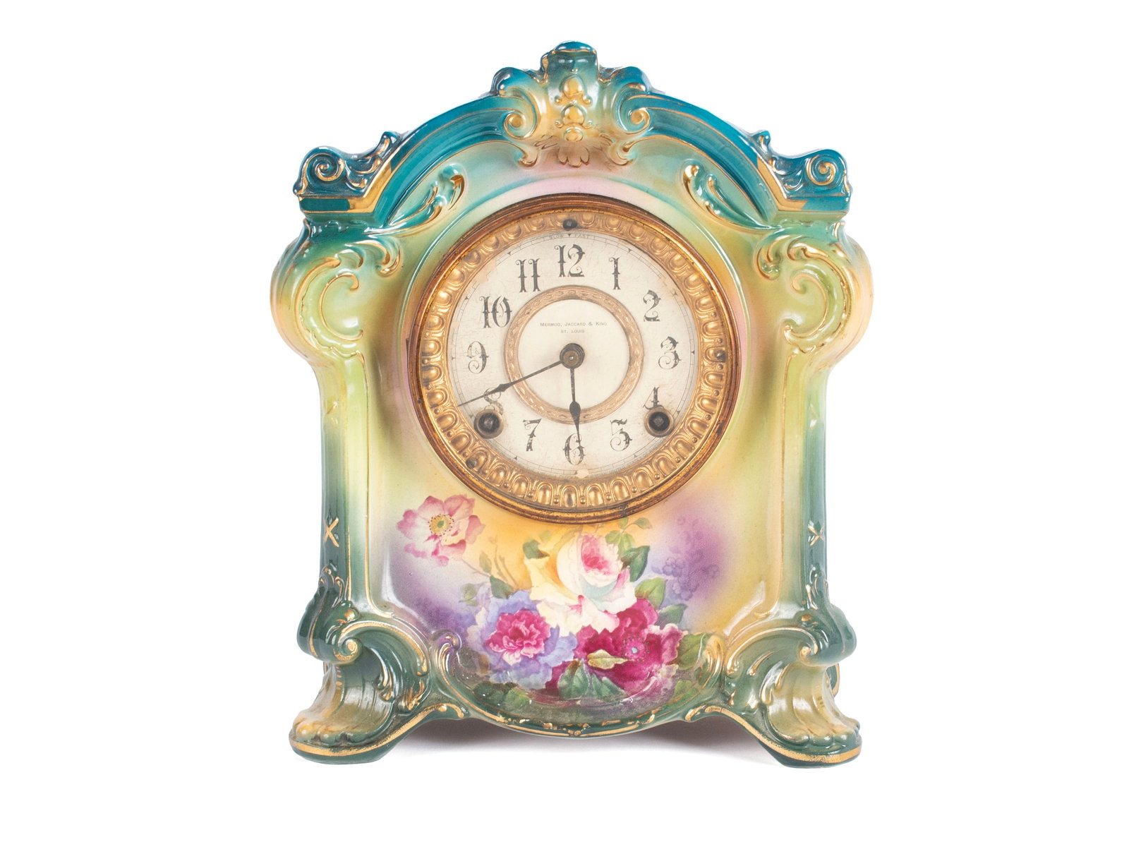 ROYAL BONN PORCELAIN CASE CLOCK: ROYAL BONN PORCELAIN CASE CLOCK German, early 20th century. Floral painted case with shades of blue and green, dial marked for retailer "Mermod, Jaccard & King - St. Louis". 11 1/2 x 9 1/4 x 5 1/4 in.