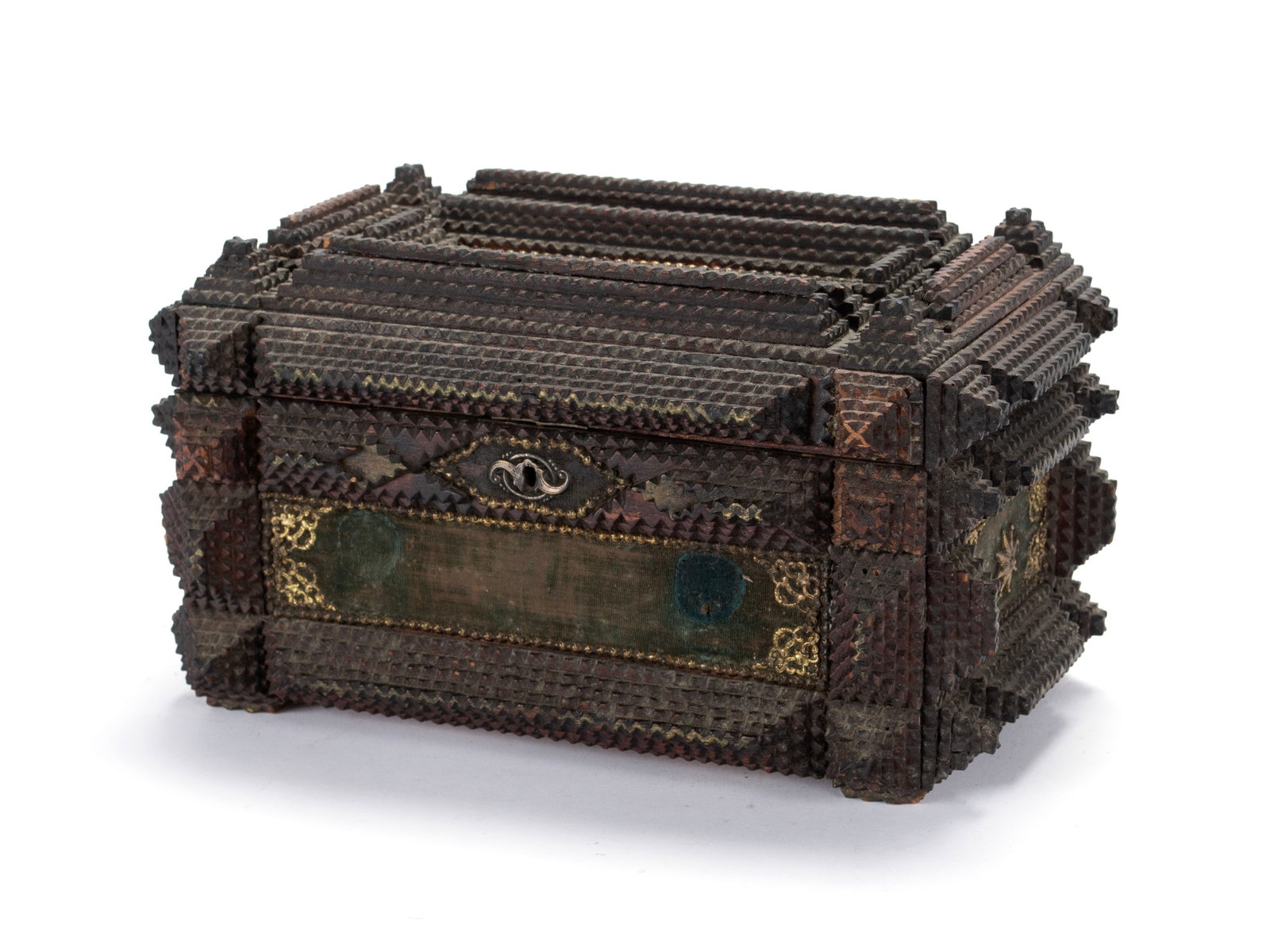 TRAMP ART BOX: TRAMP ART BOX American, 20th century. Rectangular form carved with geometric elements, velvet panels with brass ornamentation to each side. 6 1/2 x 12 x 8 in. (16.5 x 30.5 x 20.3 cm.)