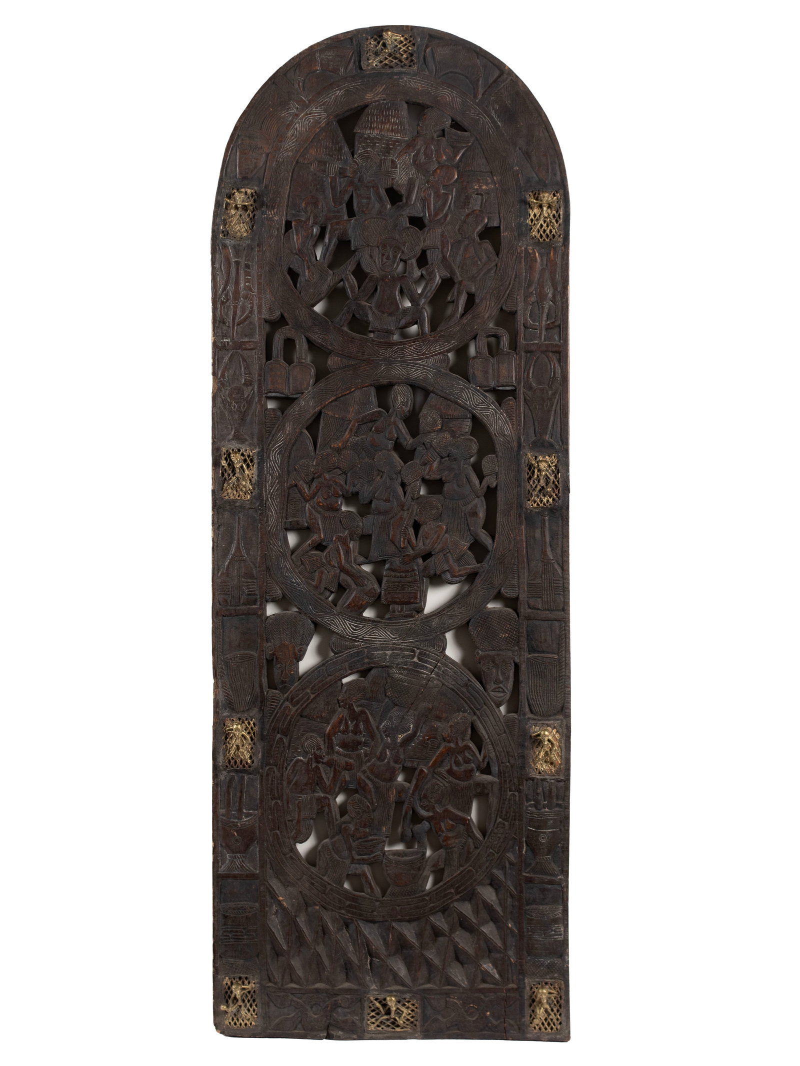 BAMOUN PALACE DOOR: BAMOUN PALACE DOOR Cameroonian, 20th century. Three pierced circular carvings showing busy figural scenes, with ten (10) inset figural bronze mounts around the edge. 66 1/2 x 23 1/2 x 2 1/2 in.