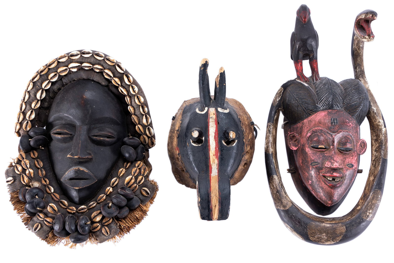 THREE CARVED WOODEN AFRICAN MASKS FROM THE IVORY COAST AREA (1 of 10)