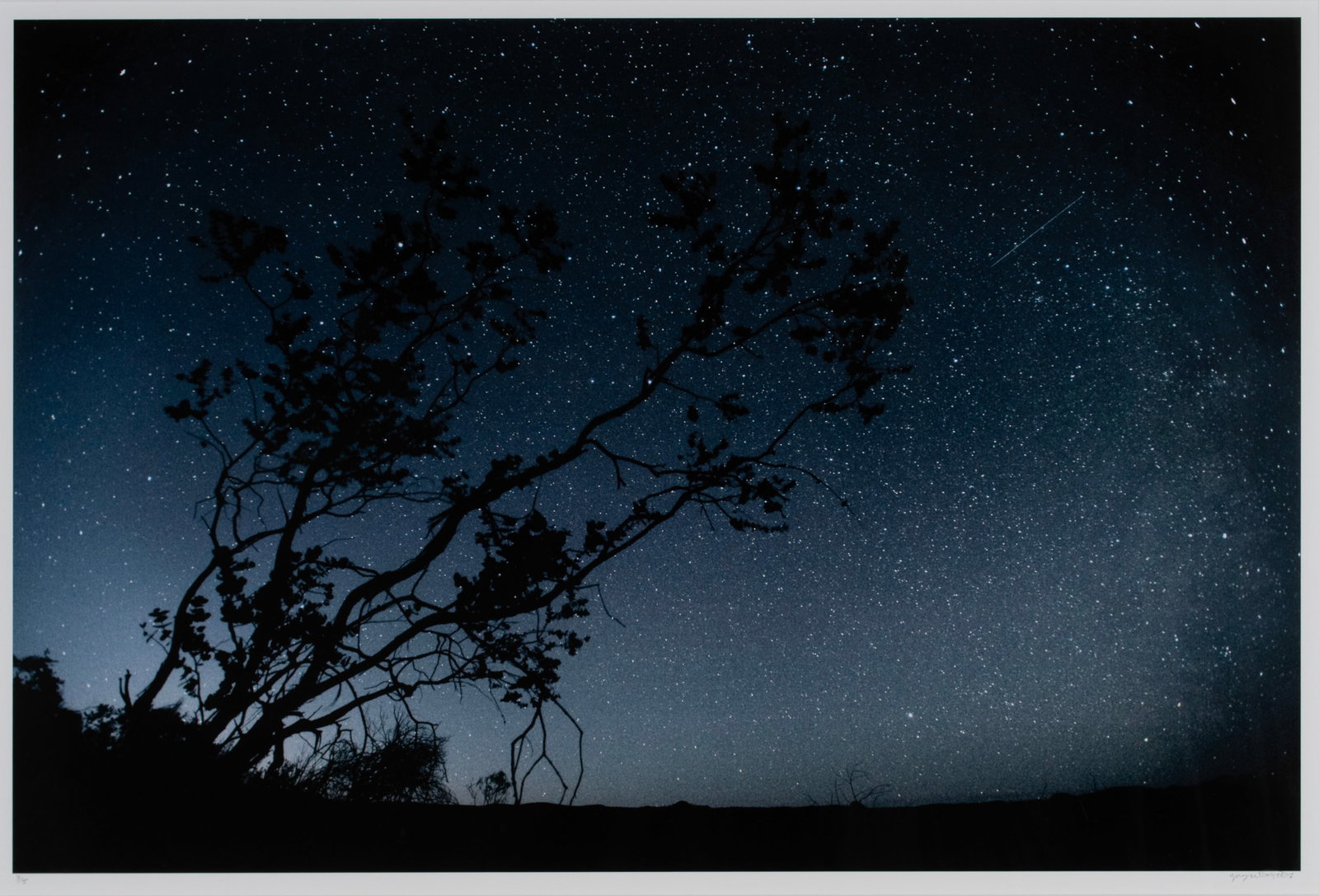 GREG WEIGHT (AUSTRALIAN, B. 1946): Greg Weight Australian, b. 1946 Spear in the Sky, 2009 Archival pigment print on rag paper Signed in pencil lower right and numbered 3/5 lower left. Night sky full of stars, matted and framed. 22 x 32