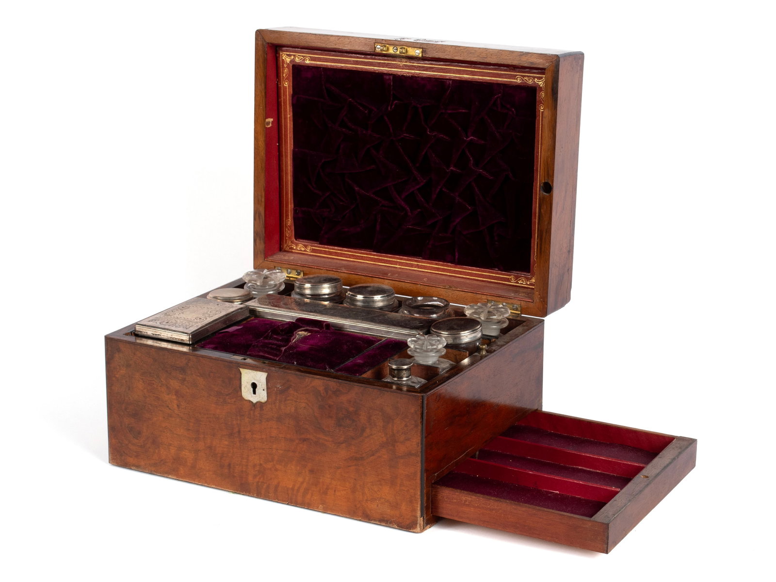 VICTORIAN DRESSING BOX WITH SILVER MOUNTED VANITY ITEMS: VICTORIAN DRESSING BOX WITH SILVER MOUNTED VANITY ITEMS 19th century. Burlwood dresser box with lift out interior tray fitted with eleven (11) glass and silverplate vanity items. 7 x 9 x 12 in. (17.8