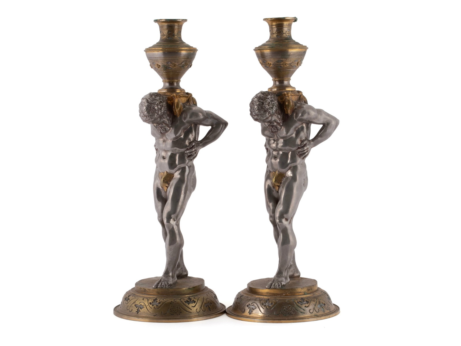 PAIR OF ATLAS FIGURAL CANDLESTICKS: PAIR OF ATLAS FIGURAL CANDLESTICKS 20th century. Pair of Neoclassical style candlesticks with silvered figures of Atlas holding the brass candle cups and on domed brass bases. 16 x 6 1/4 in. (40.6 x