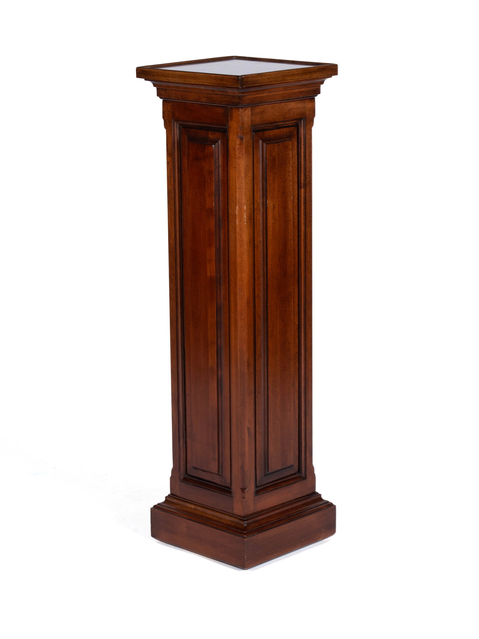 WALNUT COLUMN PEDESTAL: WALNUT COLUMN PEDESTAL 20th century. Square column pedestal with paneled sides, stepped base and top. 40 x 11 1/2 x 11 1/2 in. (101.6 x 29.2 x 29.2 cm.)