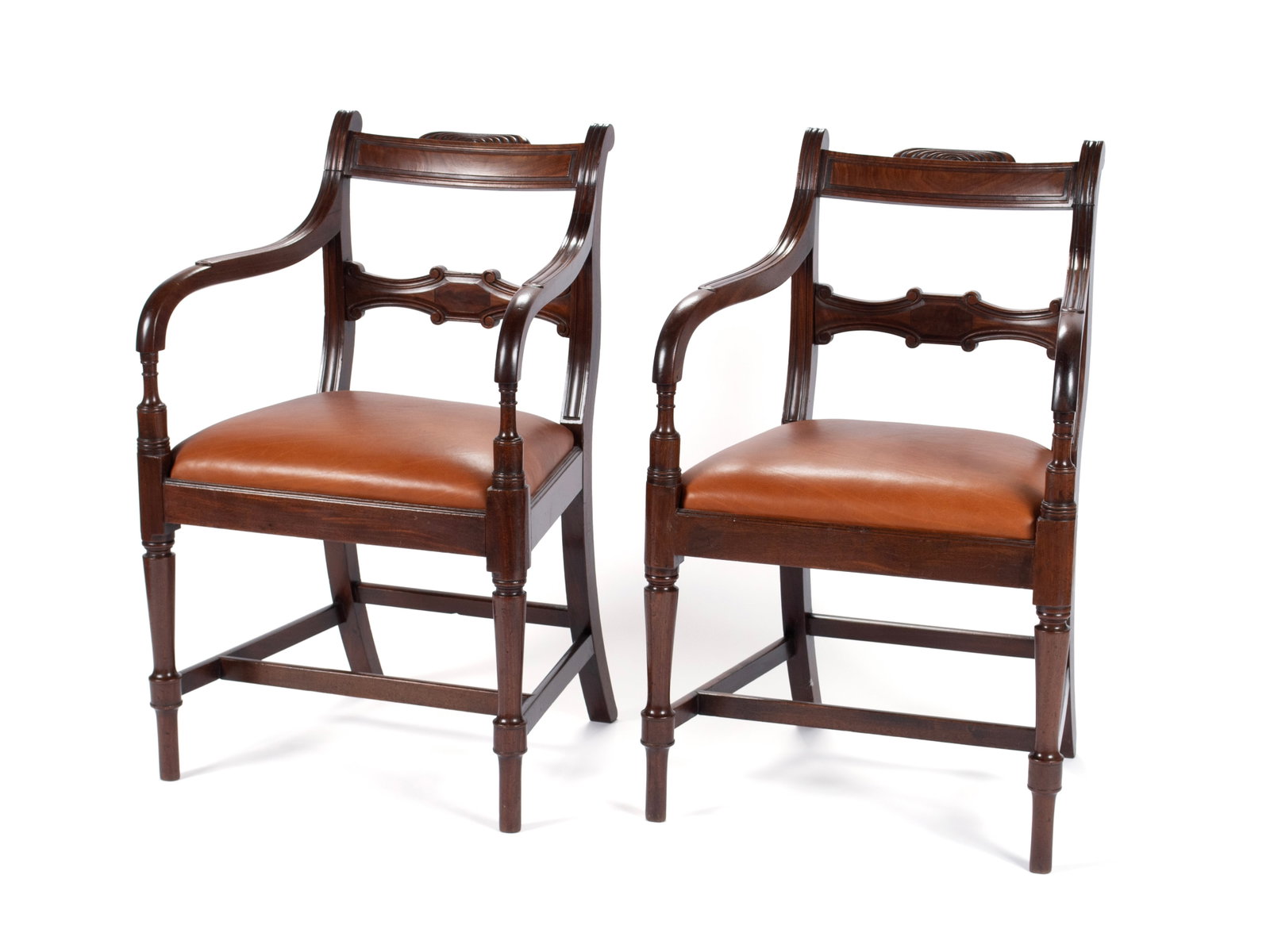 PAIR OF REGENCY STYLE OPEN ARMCHAIRS: PAIR OF REGENCY STYLE OPEN ARMCHAIRS American, 2nd quarter 20th century. Pair of mahogany open armchairs with leather upholstered seats. 34 1/2 x 22 x 17 1/2 in. (87.6 x 55.9 x 44.5 cm.)