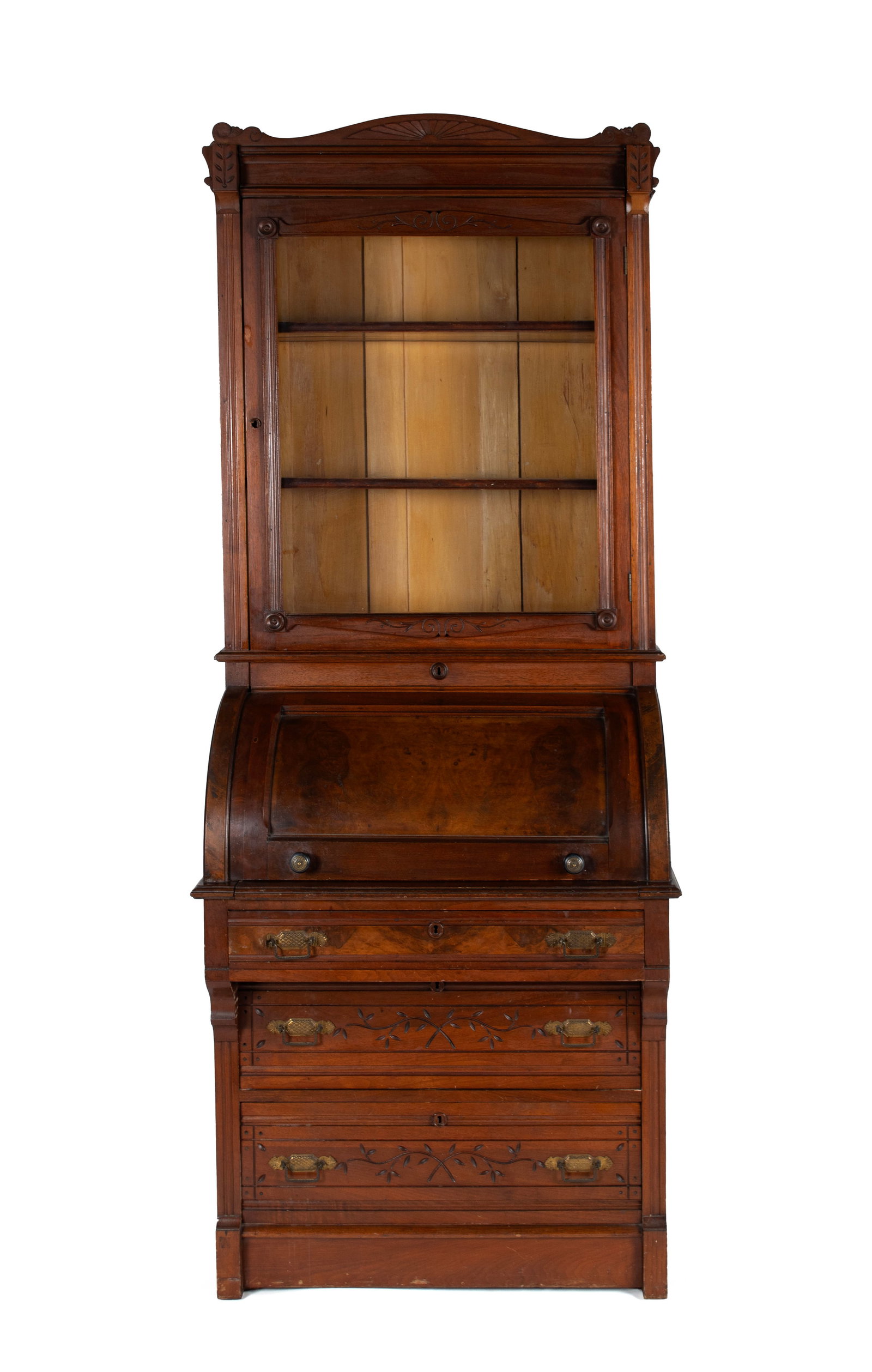 CYLINDER SECRETARY BOOKCASE: CYLINDER SECRETARY BOOKCASE American, 19th century, walnut. Single glazed door covers open shelves, over the cylinder front covering a fitted interior of drawers and pigeonholes with a slide out