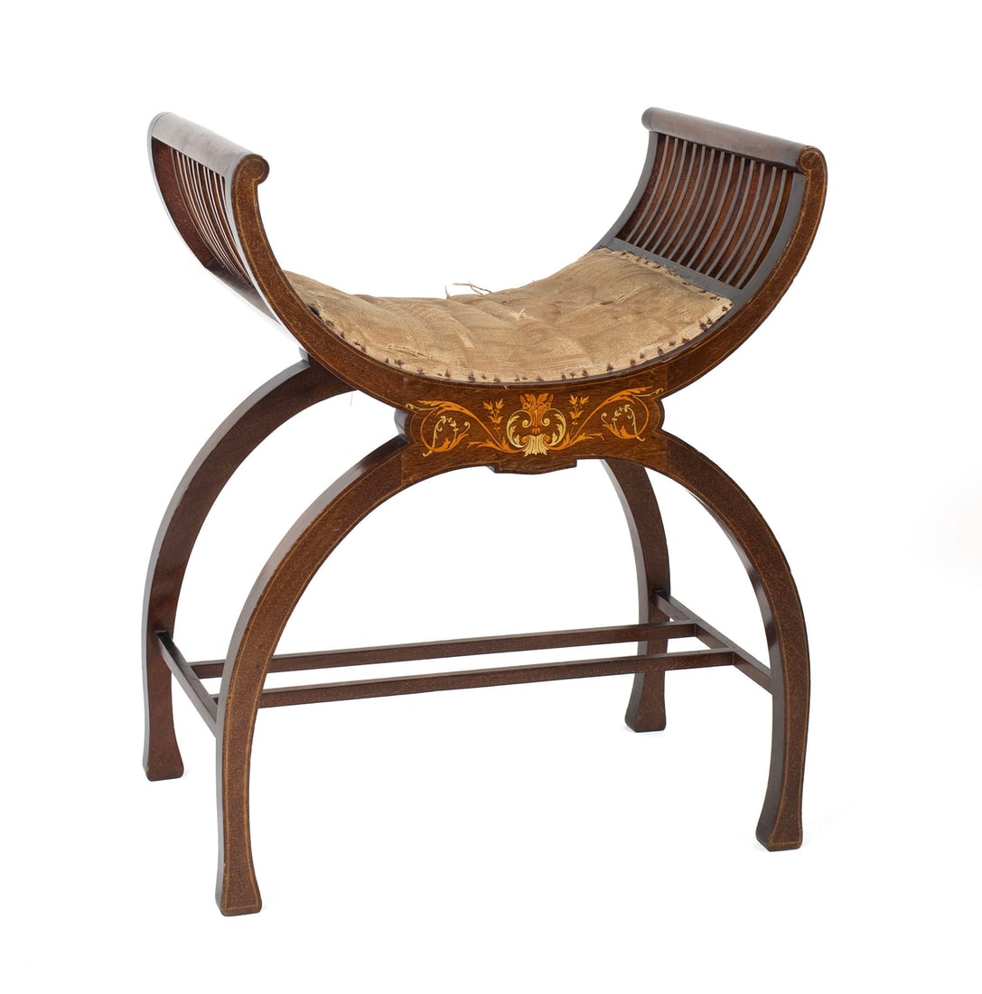 EDWARDIAN INLAID CURULE FORM STOOL: EDWARDIAN INLAID CURULE FORM STOOL English, early 20th century. Inlaid mahogany x-form upholstered stool. 27 1/2 x 22 3/4 x 15 in. (69.9 x 57.8 x 38.1 cm.)