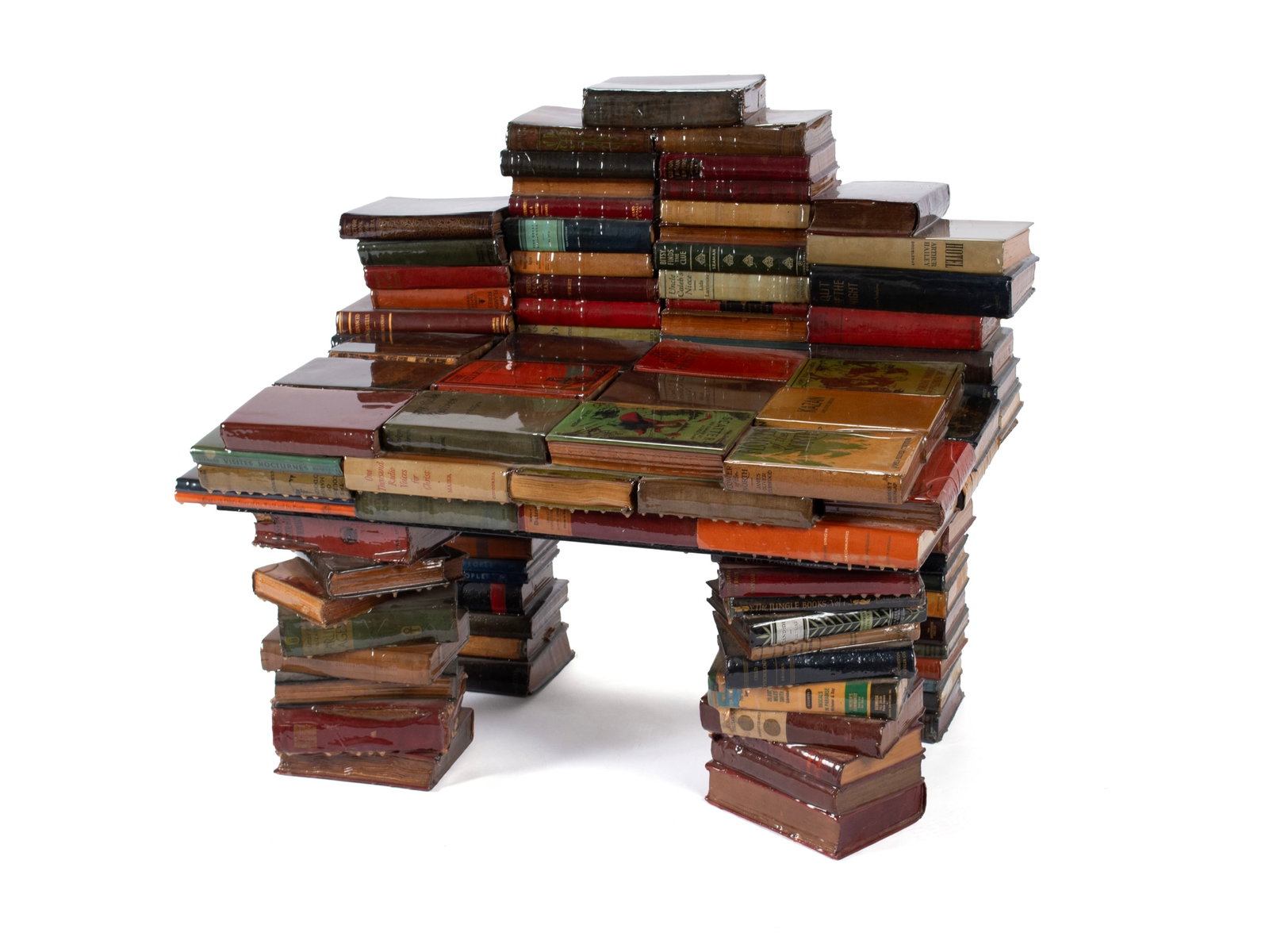SCULPTURAL BENCH OF REPURPOSED BOOKS: SCULPTURAL BENCH OF REPURPOSED BOOKS American, second half 20th century, reappropriated books. Lacquered classic hard back titles arranged in the form of a bench. Purportedly by a St. Louis artist.