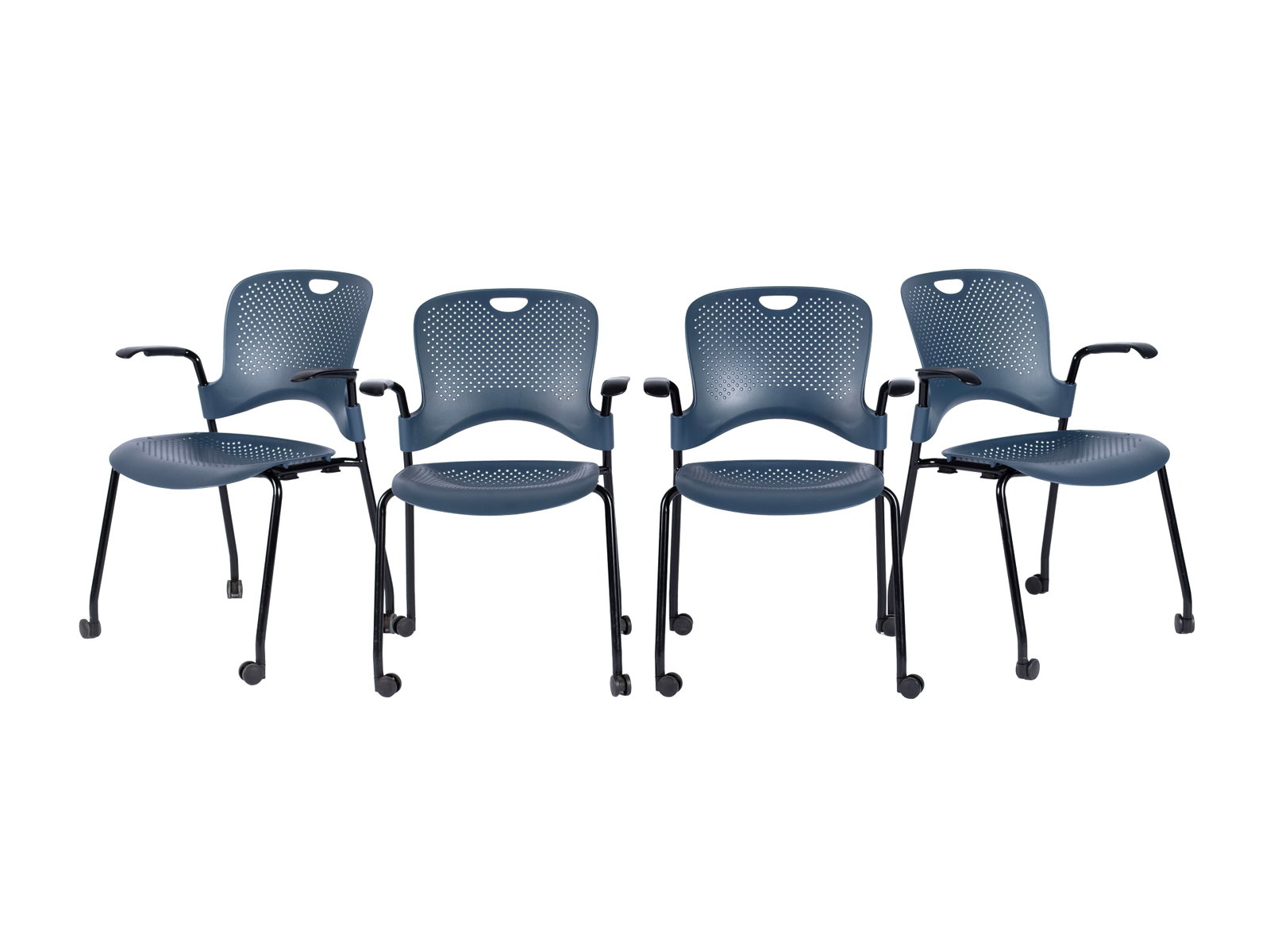 FOUR HERMAN MILLER 'CAPER' MULTIPURPOSE CHAIRS: FOUR HERMAN MILLER 'CAPER' MULTIPURPOSE CHAIRS 20th century. Set of four (4) stackable navy-blue mesh seat chairs with wheels. 32 1/2 x 20 x 24 in. (82.6 x 50.8 x 61 cm.) Ex Collection of Northland