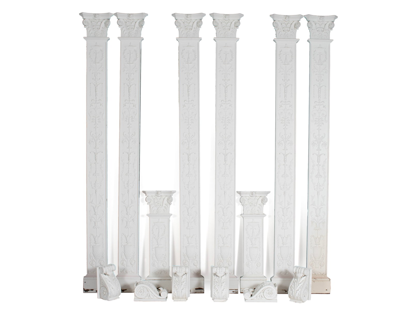 COLLECTION OF ARCHITECTURAL COLUMNS AND CORBELS: COLLECTION OF ARCHITECTURAL COLUMNS AND CORBELS 20th century, painted wood and plaster. Tall set of six (6) matching 2-dimensional columns with Adam's style elements top to bottom, with scrolling