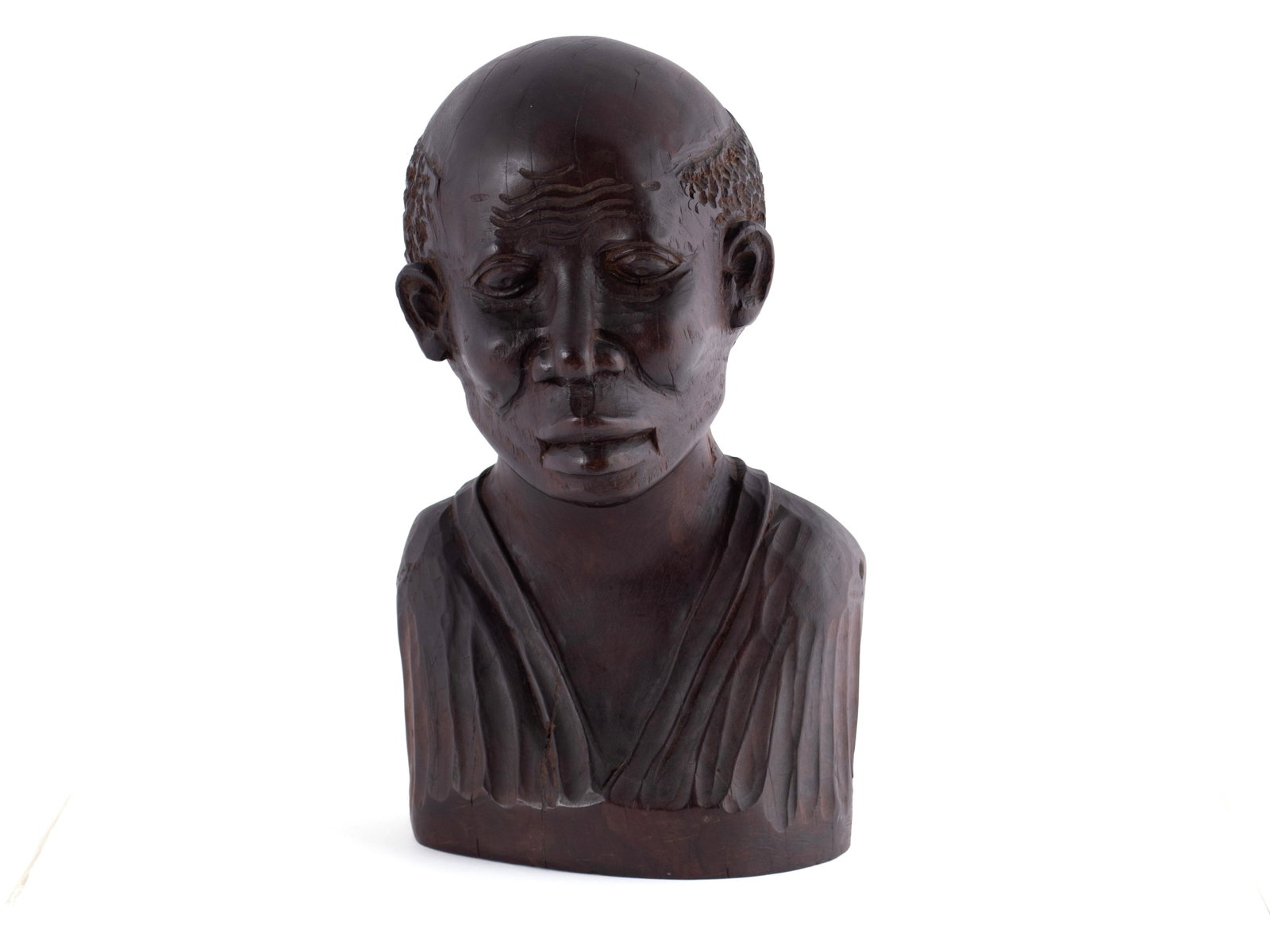 WOODEN BUST OF A MAN: WOODEN BUST OF A MAN 20th century. Carved wood bust of a man, unsigned. 13 1/2 x 6 1/2 x 8 in. (34.3 x 16.5 x 20.3 cm.)