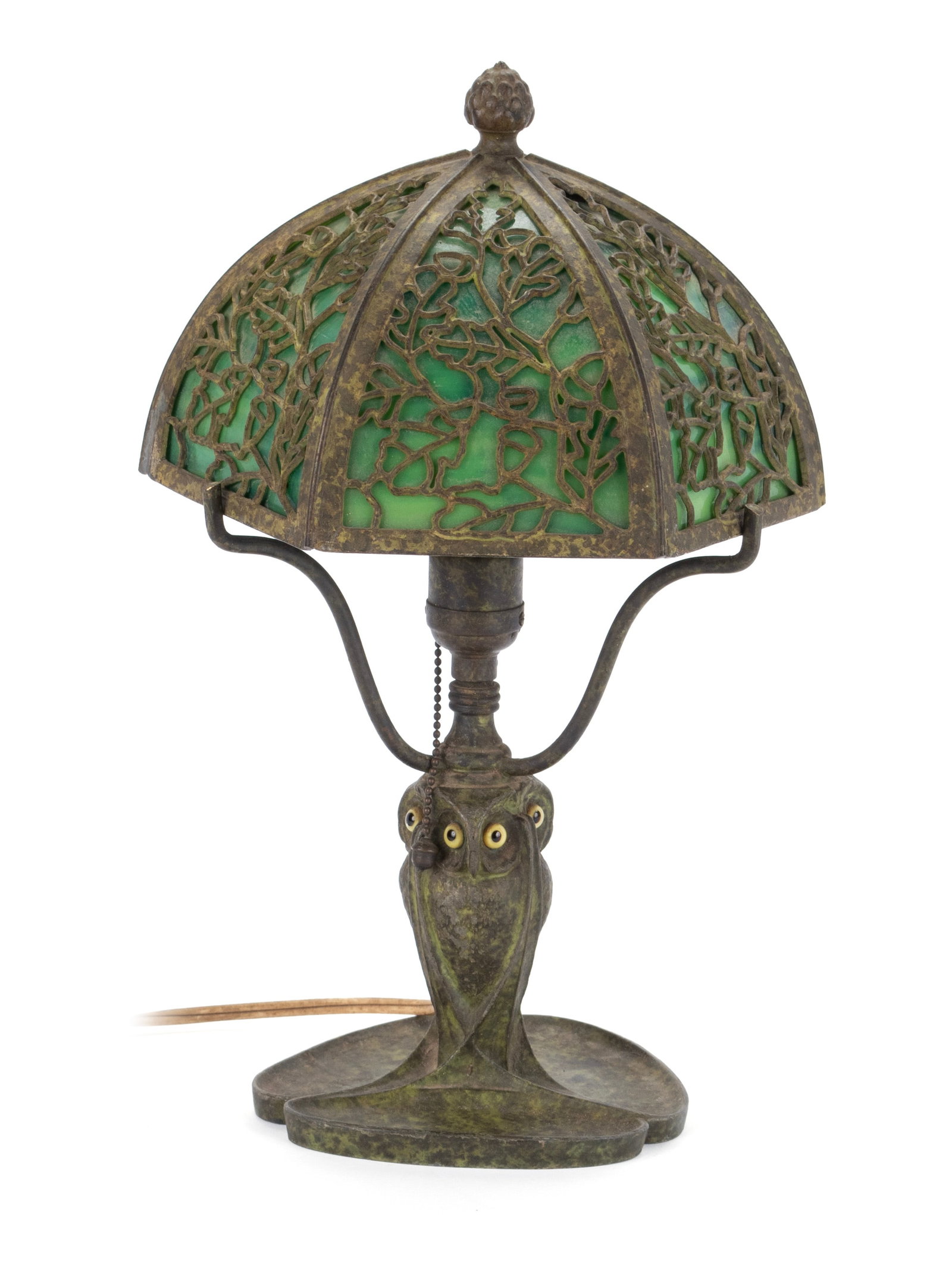 BRADLEY AND HUBBARD OWL BOUDOIR LAMP: BRADLEY AND HUBBARD OWL BOUDOIR LAMP Early 20th century, marked on underside of base. Cold painted metal base featuring three owls, with a green slag glass shade and foliate metal overlay. Overall