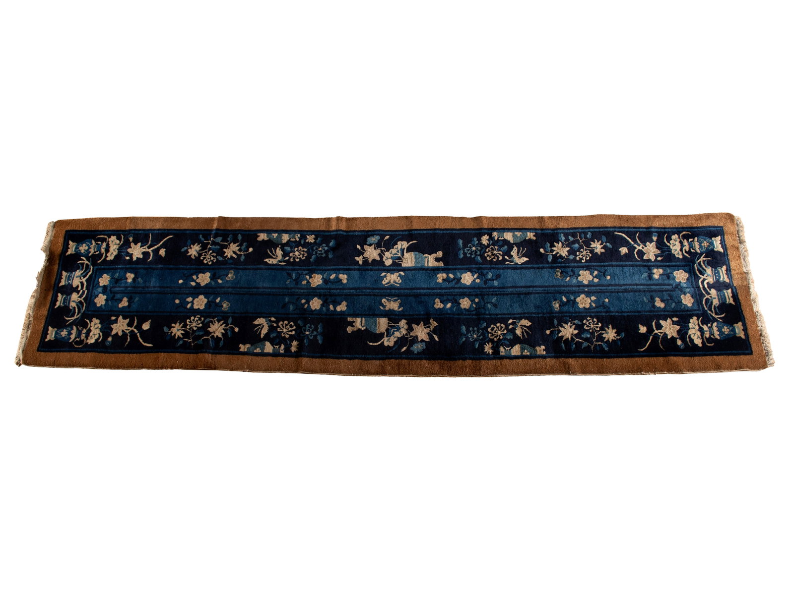 PEKING CHINESE LONG RUG: PEKING CHINESE LONG RUG Chinese, early 20th century. Navy field with beige flowers with flowering vases along the edges, brown outer border. 11 ft. 8 in. x 2 ft. 9 in. (355.6 x 83.8 cm.)