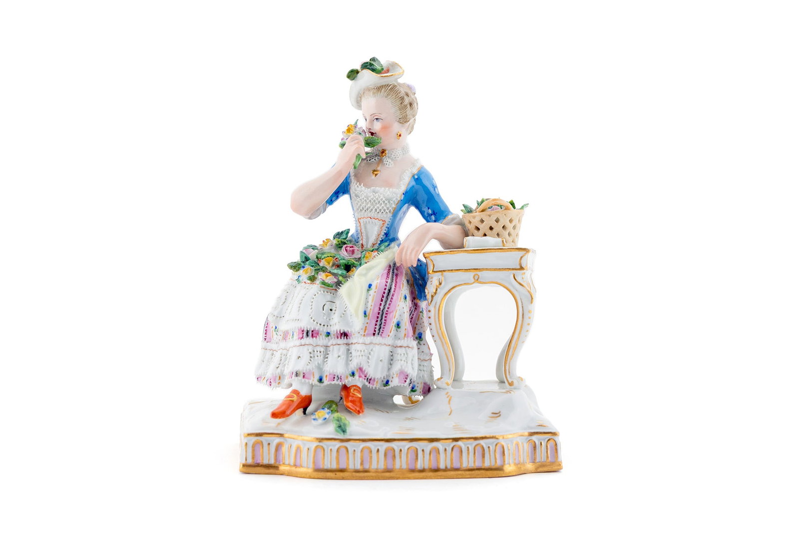 MEISSEN PORCELAIN FIGURE "ALLEGORY OF THE SENSE OF SMELL": MEISSEN PORCELAIN FIGURE "ALLEGORY OF THE SENSE OF SMELL" Germany, 19th century, Rococo-style figure of a woman seated at table smelling flours from the series of five "Senses" designed by Johan Carl 