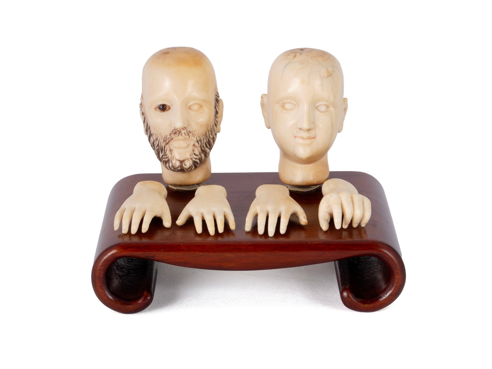 EUROPEAN CARVINGS: EUROPEAN CARVINGS Continental, 19th century. Two carvings of a man's head, one bearded, together with two sets of hands (6 pieces). Heads: 2 in. (5.1 cm.)
