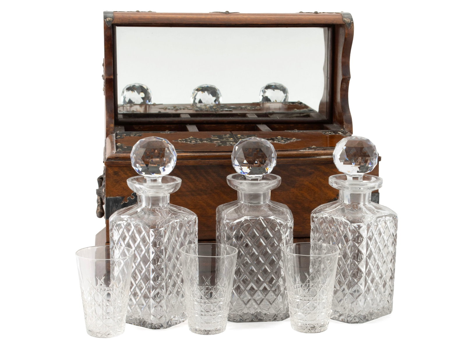 OAK TABLETOP BAR CABINET/TANTALUS: OAK TABLETOP BAR CABINET/TANTALUS English, circa 1890. Solid tiger oak case with plated silver highlights, showing a fixed bar over the set of three stoppered decanters, resting back from the hinged