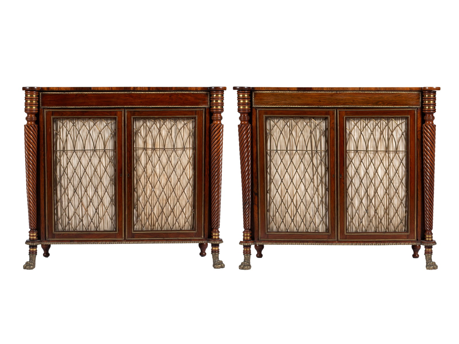PAIR OF REGENCY ROSEWOOD SIDE CABINETS: PAIR OF REGENCY ROSEWOOD SIDE CABINETS English, 19th century. Brass inlaid cabinets with finely turned and spiraling turret front corner pilasters, with a pair of metal trelliswork covering the gilt