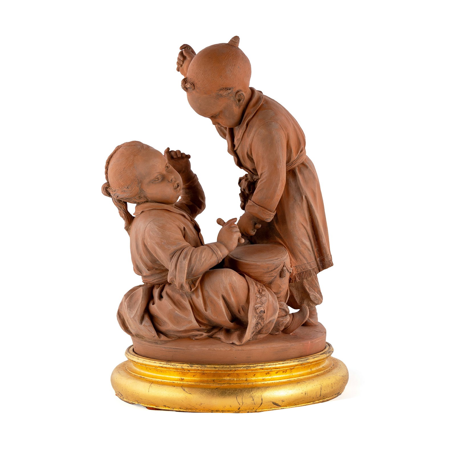 FRENCH CHINOISERIE TERRACOTTA FIGURAL GROUP: FRENCH CHINOISERIE TERRACOTTA FIGURAL GROUP Late 19th/early 20th century, Orientalist Chinese boy and girl with drum. 12 1/2 x 10 in. (31.8 x 25.4 cm.) Provenance: Property from The Sam and Marilyn Fo