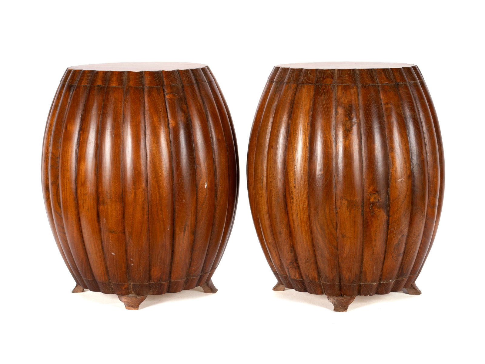 PAIR OF CHINESE HARD WOOD BARREL STOOLS: PAIR OF CHINESE HARD WOOD BARREL STOOLS Chinese, circa 1900, pair of footed lobed-barrel form stools. Each: 20 x 15 in. (50.8 x 38.1 cm.)