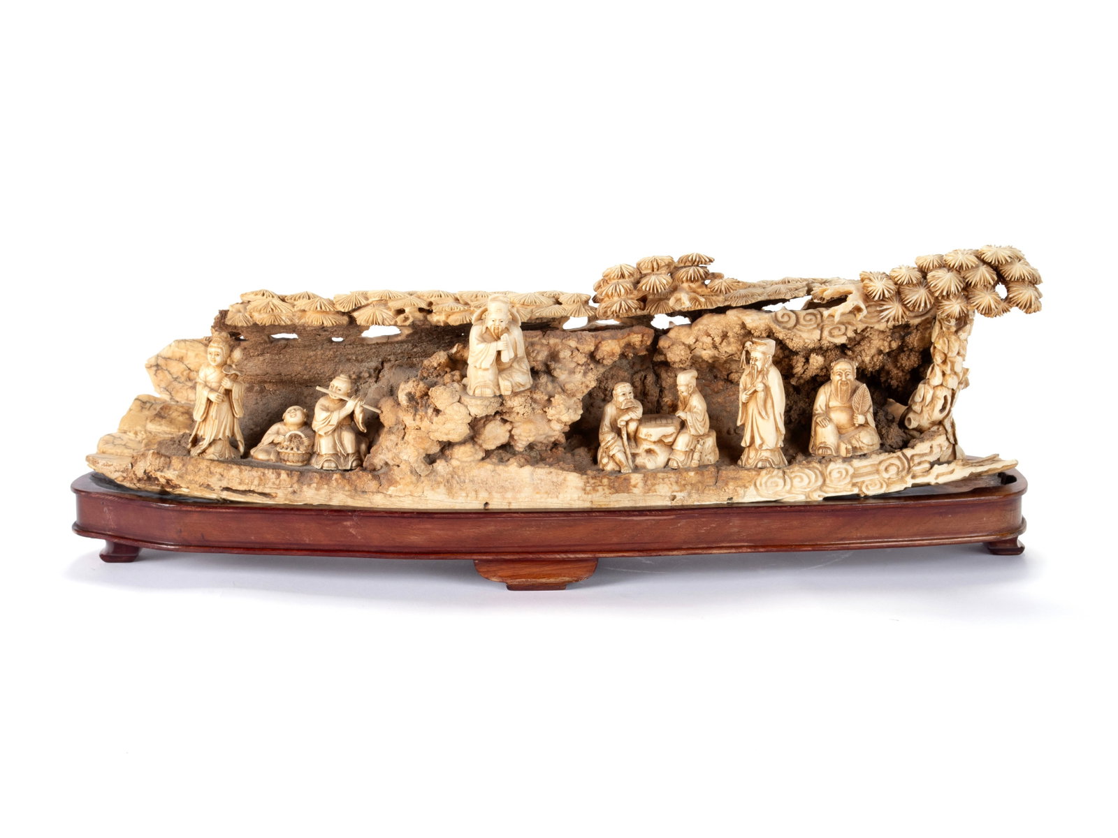 CHINESE CARVED MAMMOTH TUSK: CHINESE CARVED MAMMOTH TUSK Early 20th century. Intricately carved in the half-round with various genre scenes including musician, peddler, woman with scepter, and several seated elders, the top carve