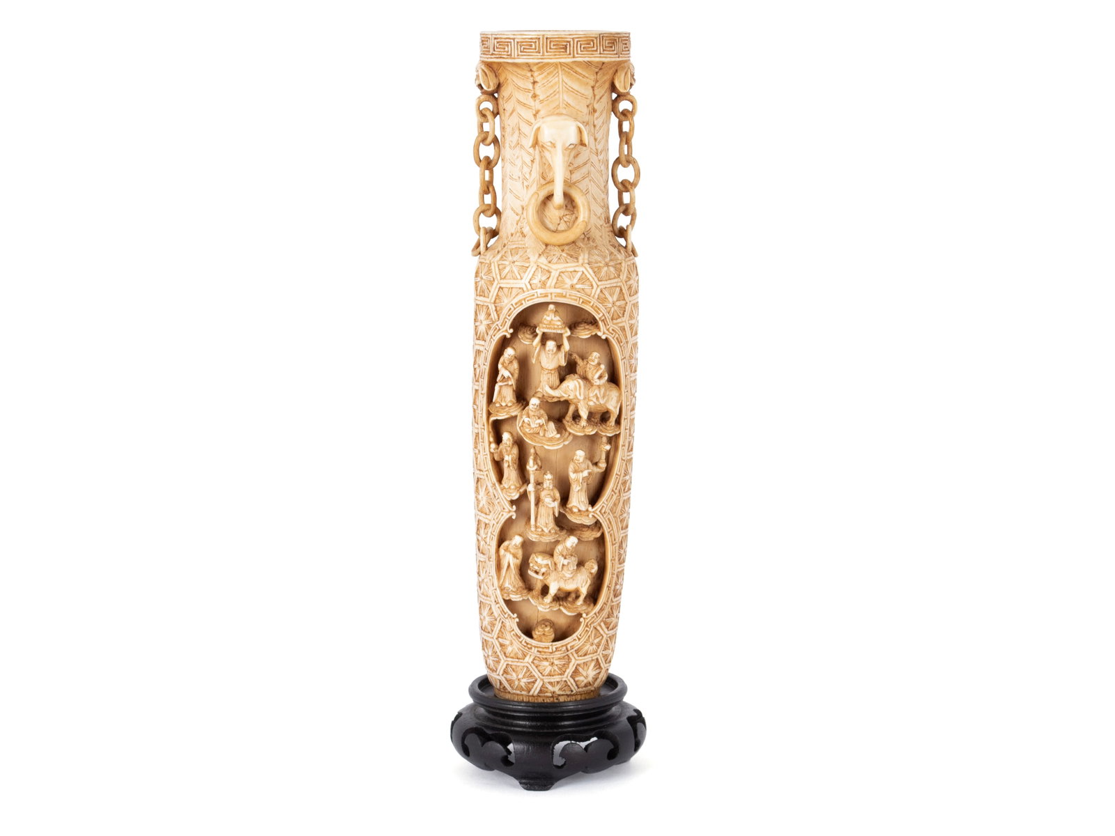 CARVED CHINESE VASE: CARVED CHINESE VASE Chinese, 19th century. Greek key decorated upper rim with fu dog and elephant handle highlights, over the allover floral carved vessel with fine detailed figural panels to both