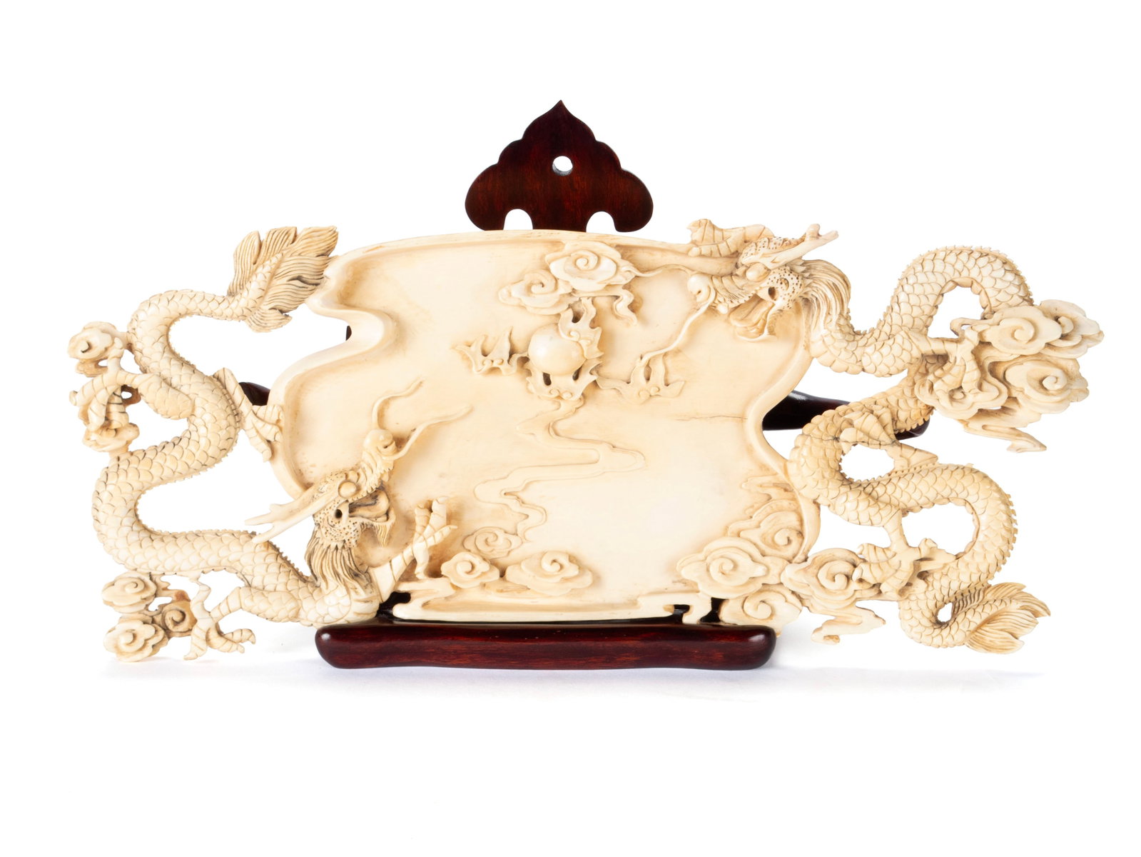 CHINESE CARVED DRAGON TRAY: CHINESE CARVED DRAGON TRAY Bovine, late 19th/early 20th century. Shaped tray with each end showing a finely detailed carving of a pair of four-toed dragons chasing flaming pearl. 13 x 5 1/2 in. (33 x